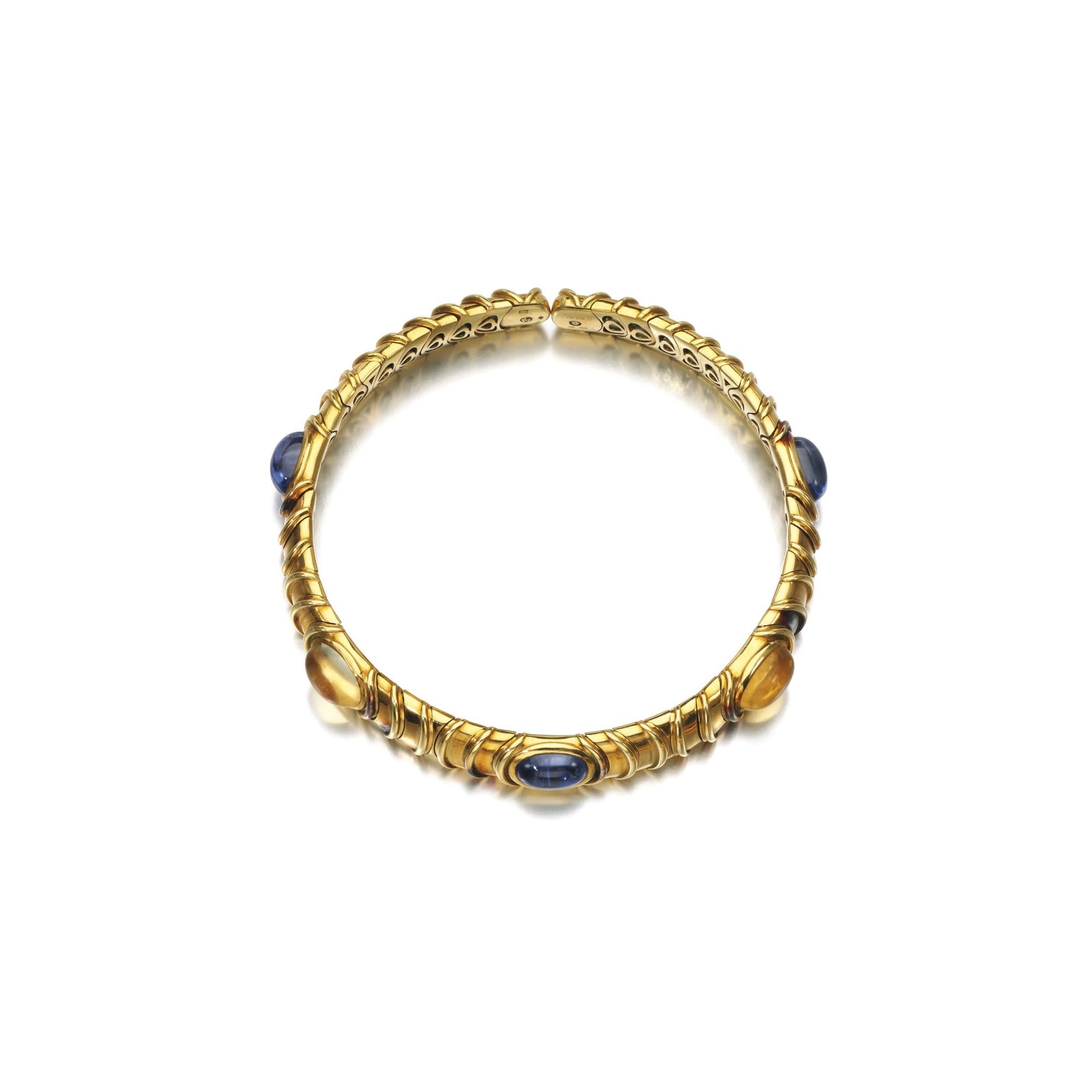 Marina B 18kt yellow gold choker, enriched with alternated blue and yellow cabochon sapphires. Made in Italy, circa 1984.