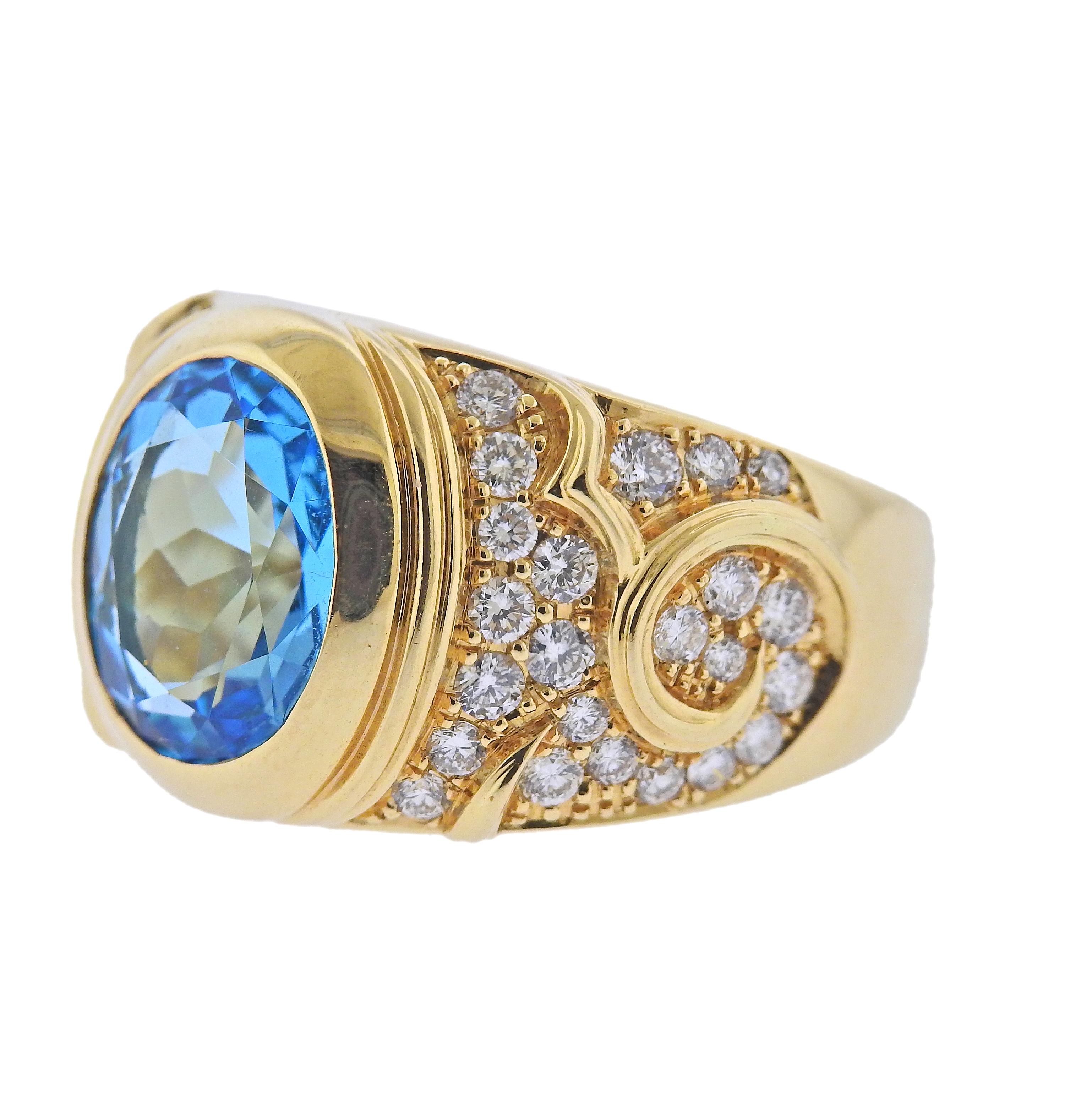 18k gold cuff ring by Marina B, with center approx. 3.70ct blue topaz, surrounded with approx. 1.20ctw in G/VS diamonds. Ring size 7, ring top is 15mm wide. Marked: Marina B, 750, 12004. Weight - 13 grams.