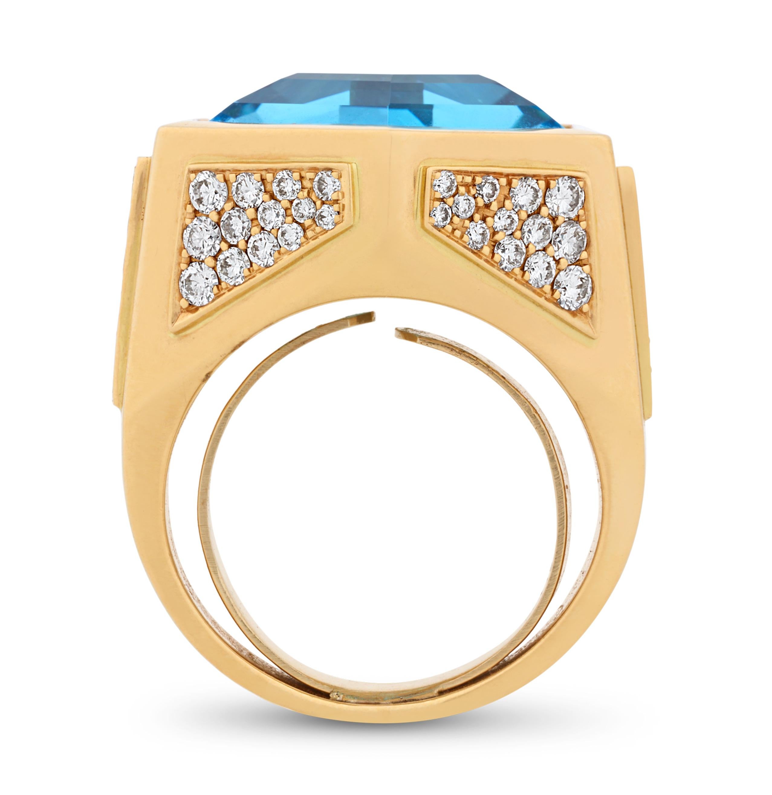 In der Mitte dieses Rings glänzt ein atemberaubender Blautopas im Sechseckschliff mit einem Gewicht von 17 Karat. Dieser kunstvolle Cocktailring, der von der angesehenen italienischen Juwelierin Marina B entworfen wurde, setzt ein kühnes und