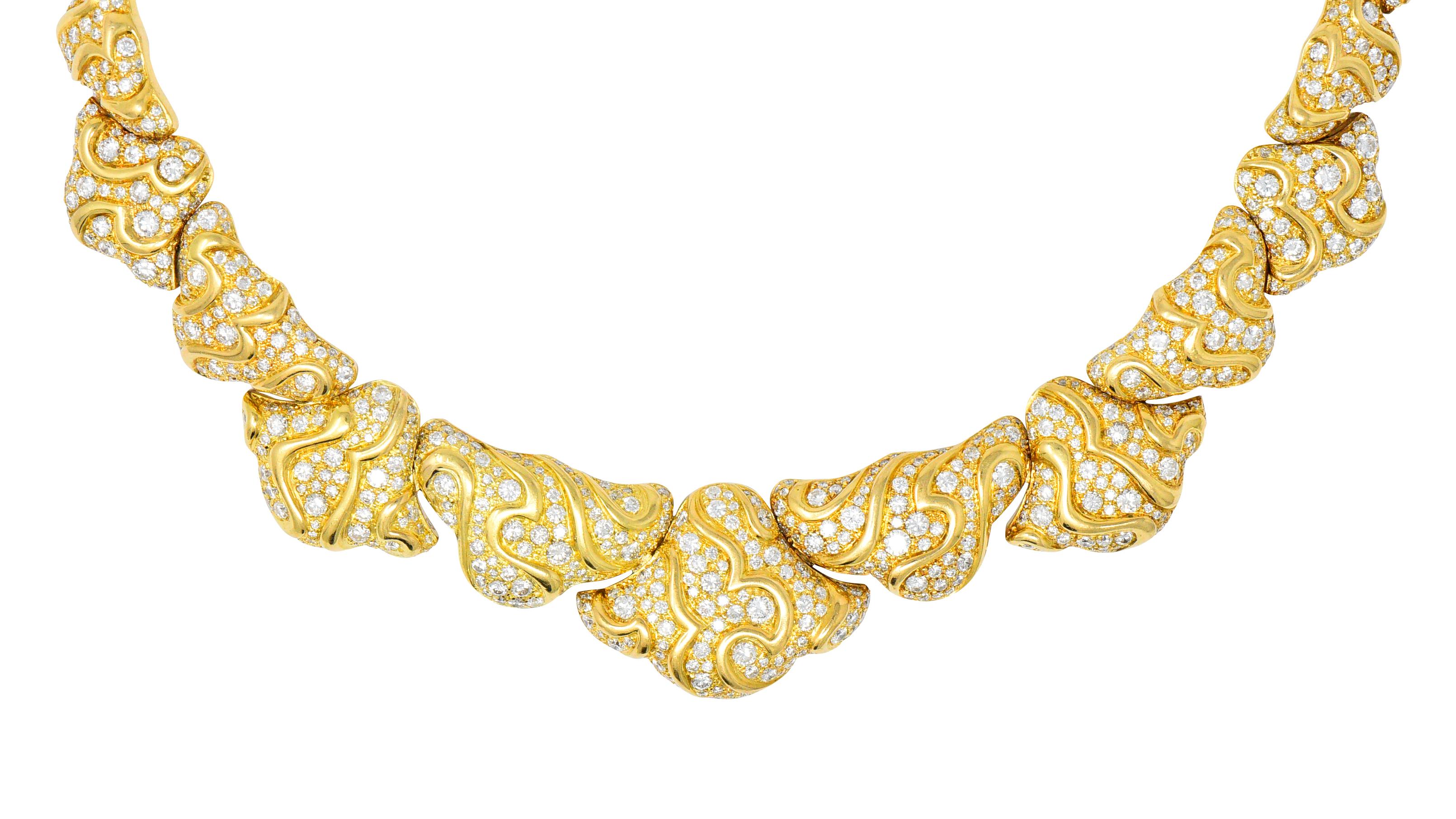 Designed as fluted abstract graduate links with pavé set round brilliant cut diamonds and high polished gold webbed throughout

Total diamond weighing approximately 17.00 carats, G/H color and VS to SI clarity (most VS)

Collar style necklace with a