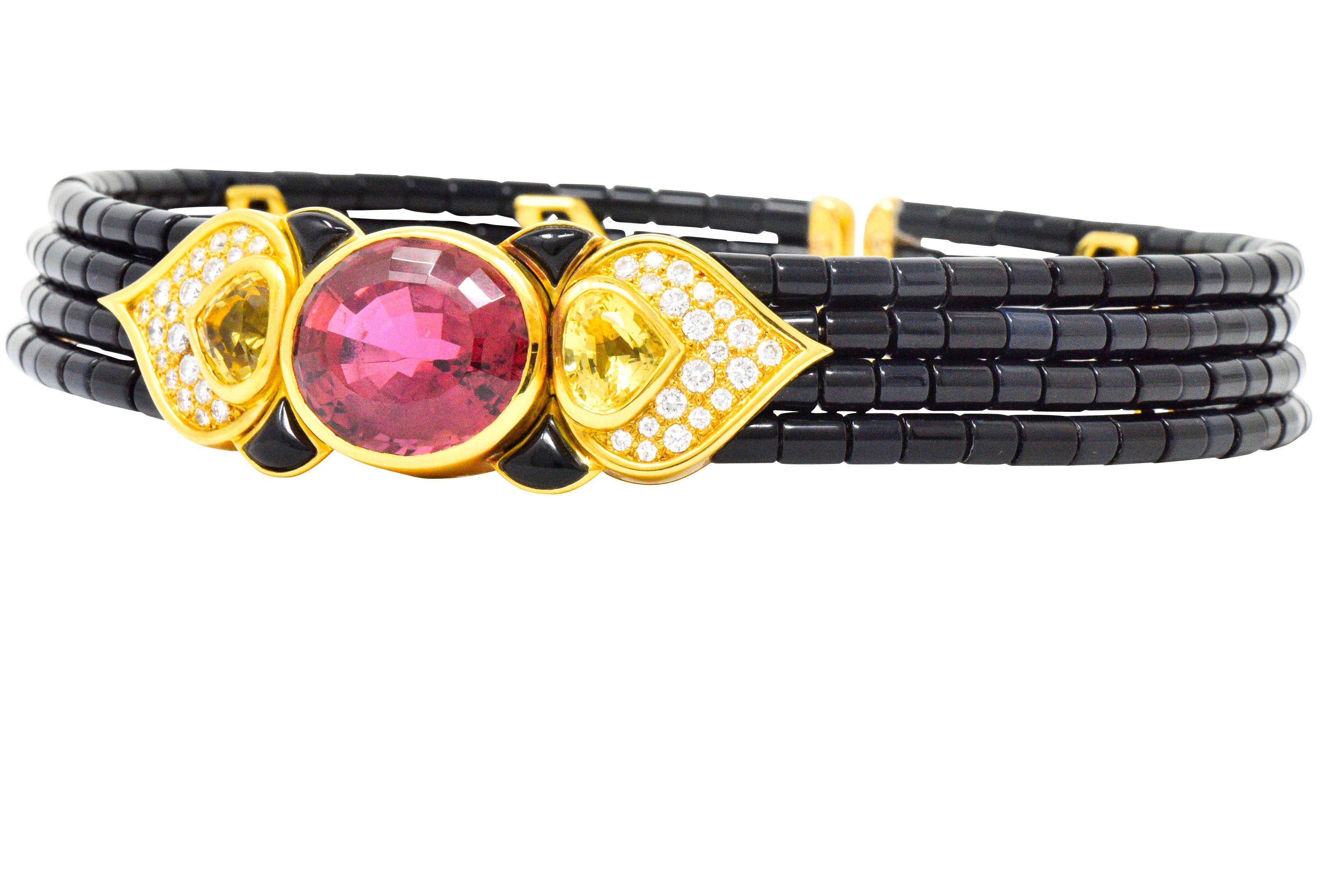 Designed as a flexible collar style necklace centering an oval mixed cut pink tourmaline weighing approximately 25.00 carats, vivd deep pink

Flanked by modified pear cut citrines measuring approximately 7.5 x 9.0 mm, bright deep yellow

Accented by