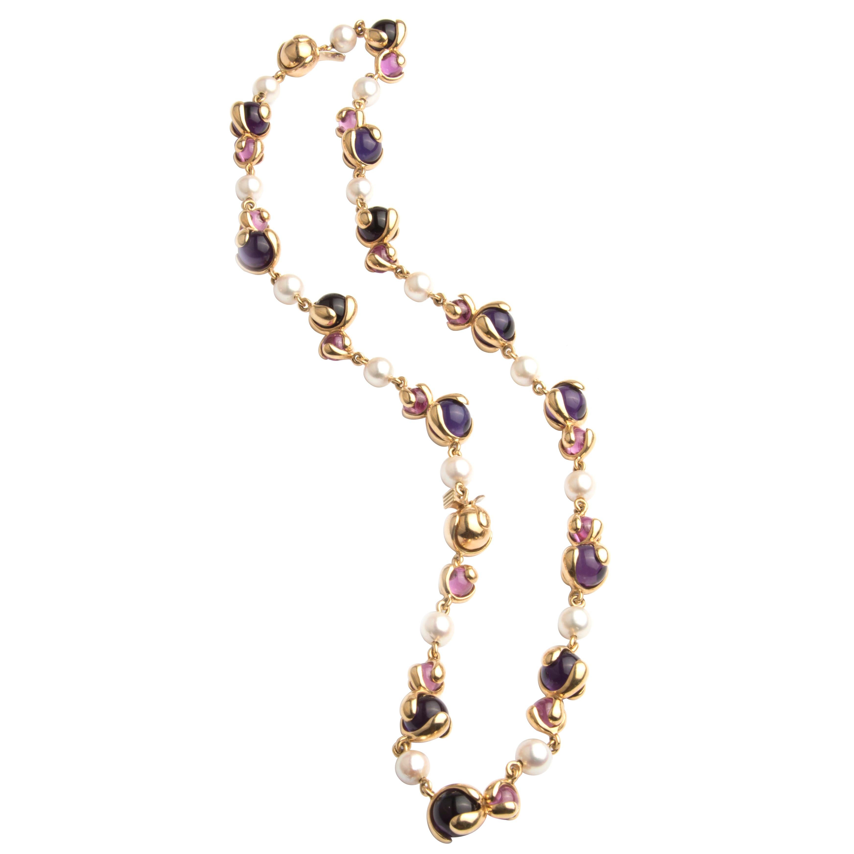 A stylish and very wearable sautoir necklace by Marina B from the Cardan collection. The multiple locks allow it to be separated into two parts, so it can also be worn as a chocker necklace and and bracelet. 
18k yellow gold with cultured pearls and