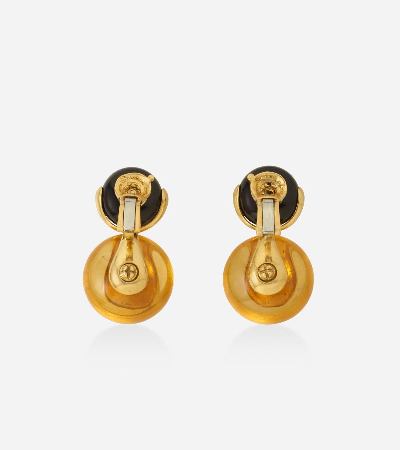 Iconic Cardan earrings by MARINA B, a pair of Russian Quartz, diamond and onyx drop earrings in 18k yellow gold.
Marina B maker's mark, numbered, stamped 750, circa 1987
 
Dimensions: 1,25 x 0,75 in 
Gross weight: 37 g. 

Publication: Marina B The
