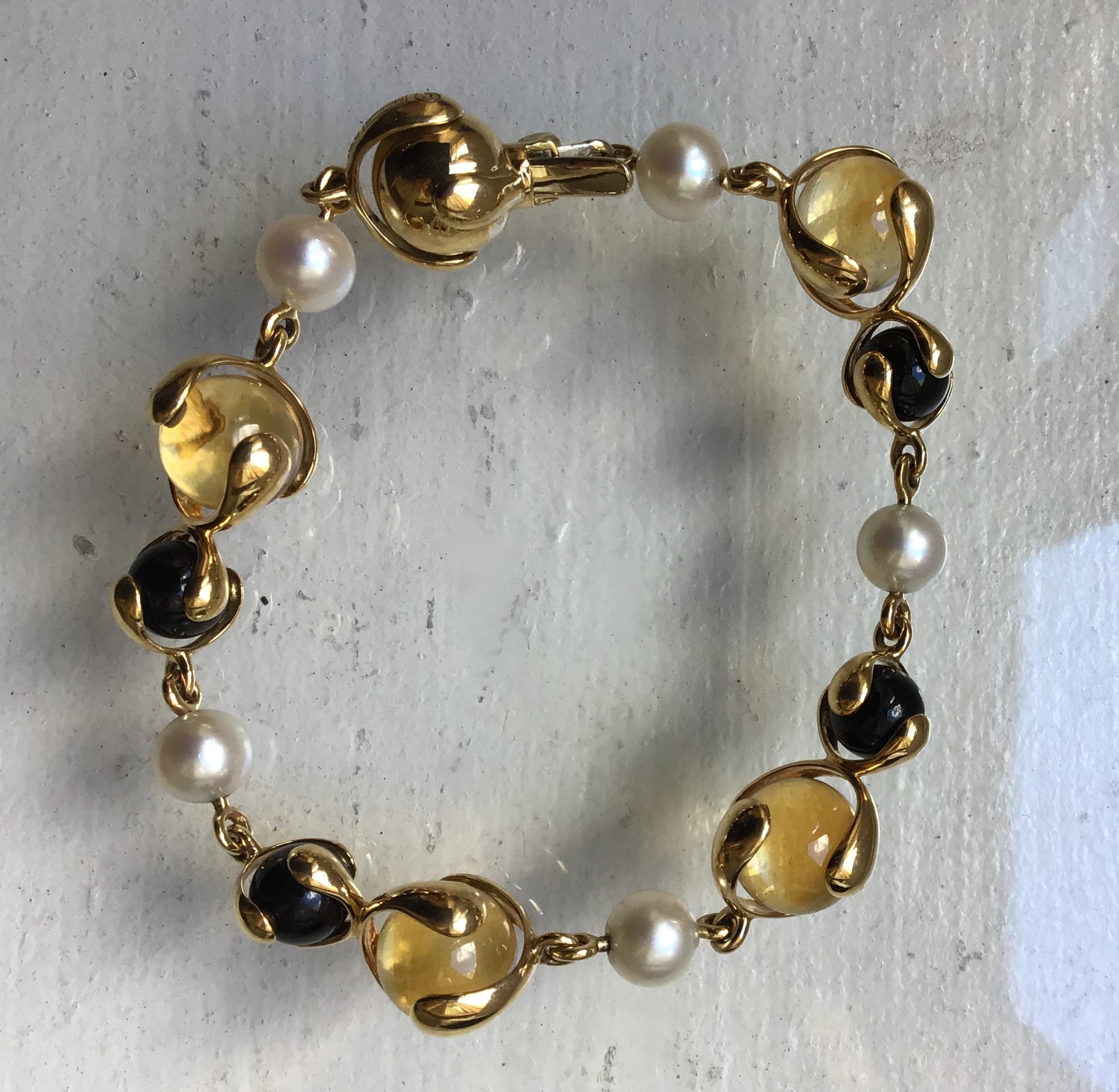 18-Karat Gold Cardan Bracelet with 29.24ct Citrine, 12.15ct Black Pearl and 15.15ct Pearl with box clasp closure

Polished 18-karat yellow gold hardware and frame

Signed Marina B, Made in Italy and numbered 580012
