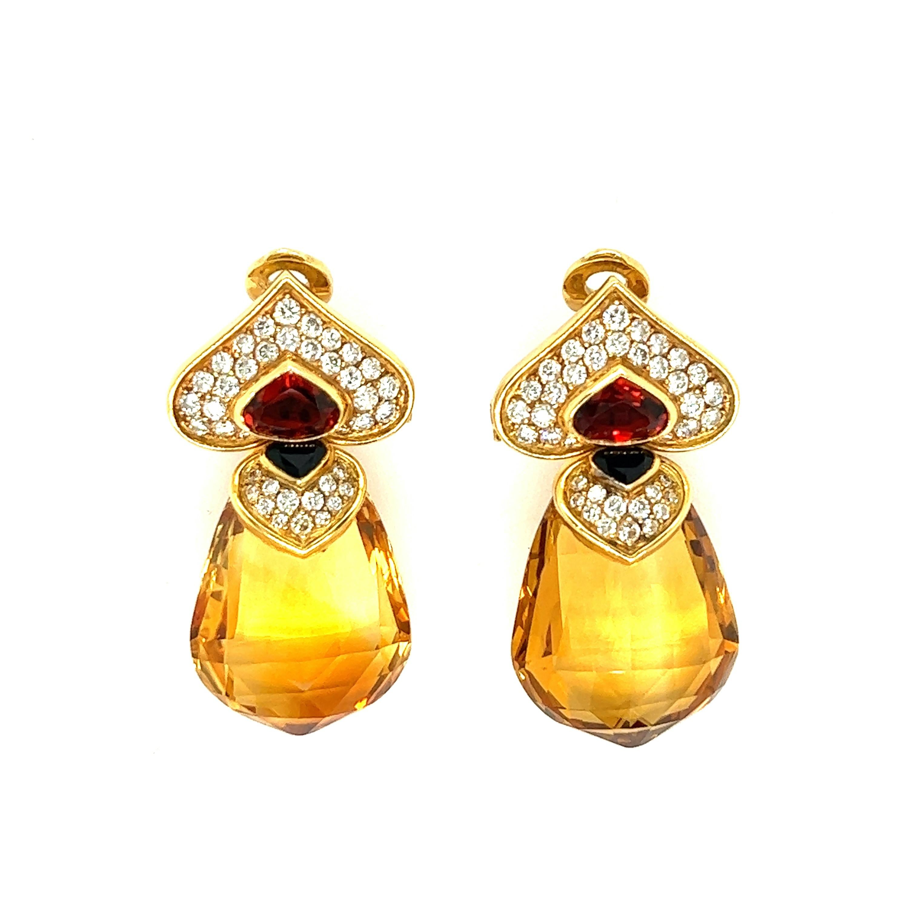 Marina B Citrine Diamond Quartz Drop Ear Clips, French

A pair of stunning multi-gems ear clips by Marina B, featuring large drop (21.70 mm x 27 mm) and bezel-set pear-shaped citrines of approximately 70 carats total, bezel-set pear-shaped smoked