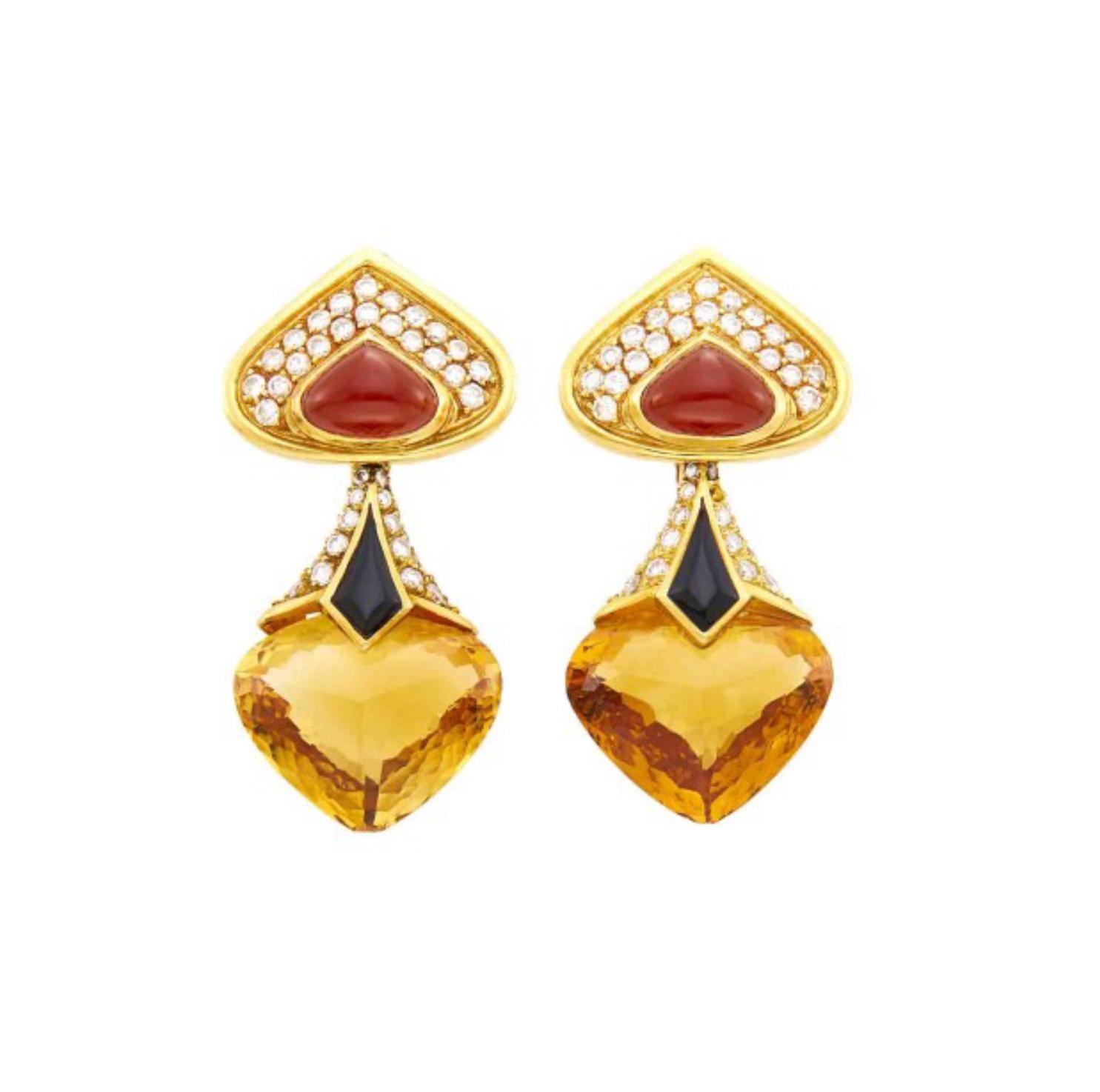 A beautiful pair of 18 karat yellow gold citrine earrings by Marina B, accented by diamonds, carnelian, and onyx. Approximately 22.90 carats of citrine and 1.75 carats of diamonds. Made in France, circa 1989. Measuring 1 5/8 x 13/16 inches.