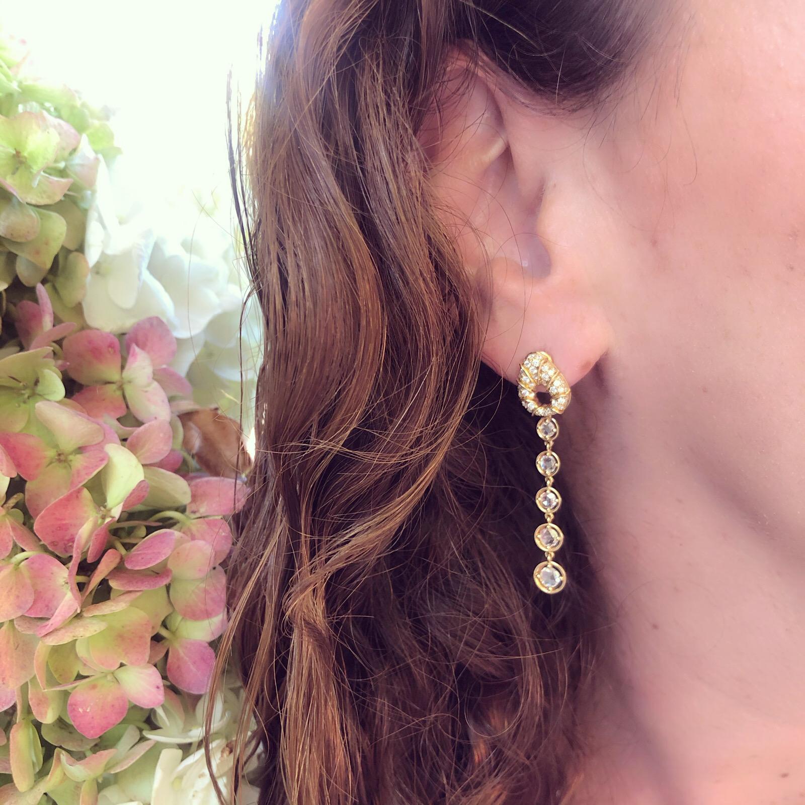 These elegant drop earrings will become your new go-to pair! By Marina B. of the famed Bulgari family, the 18k gold drops are designed with round brilliant-cut diamond pave tops, suspending rose-cut diamond links, with a total diamond weight of 1.74