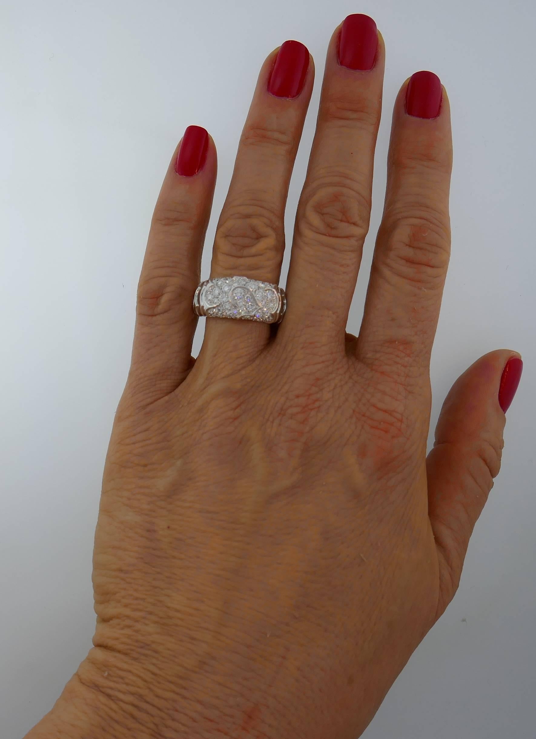Elegant, timeless and wearable ring that is a great addition to your jewelry collection. Created by Marina B in Italy in the 1980's, the ring is made of 18 karat white gold and set with round brilliant cut diamonds (F-G color, VS clarity, total