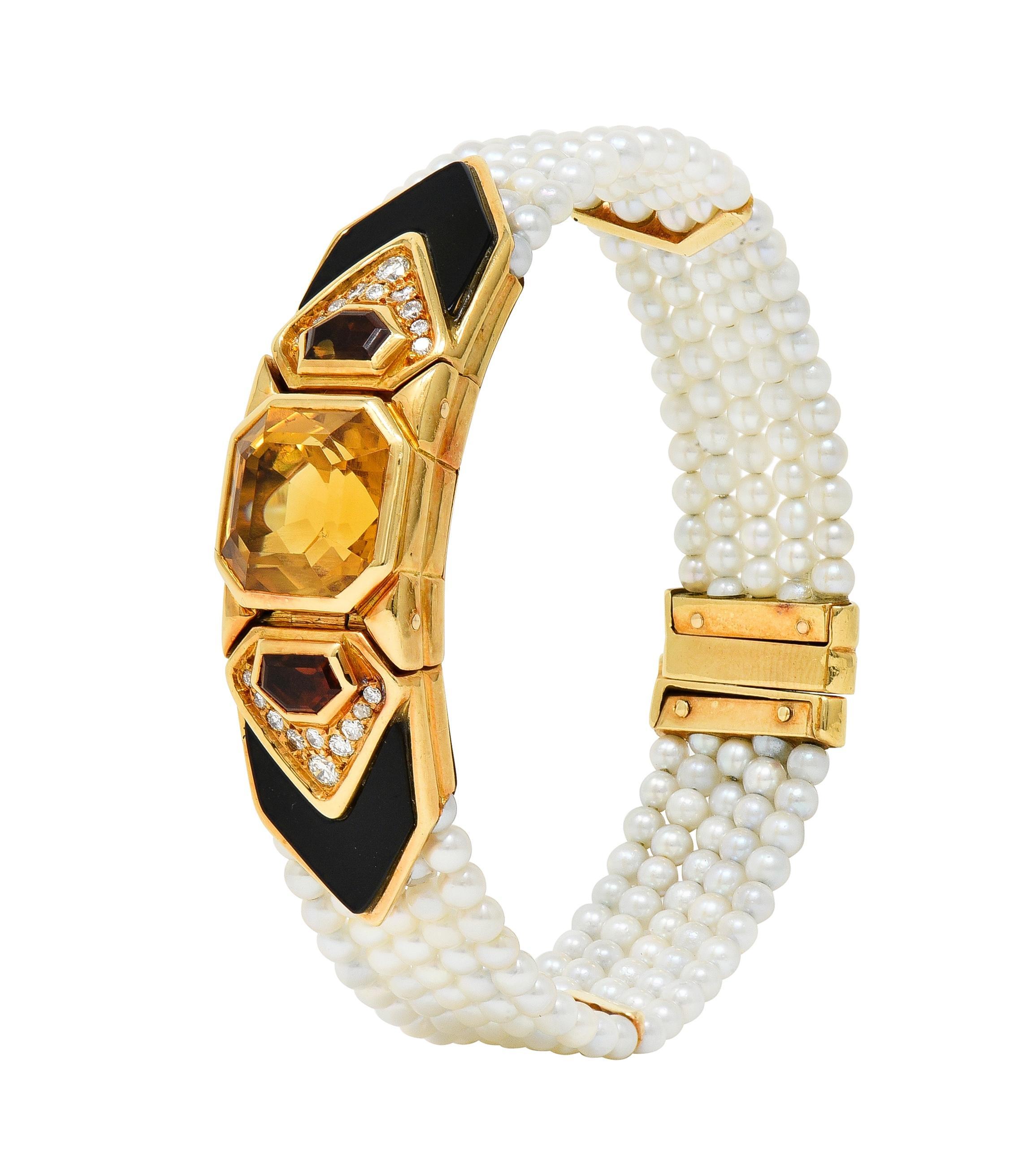 Designed as a multi-strand bracelet with a geometric central station featuring an emerald cut citrine 
Weighing approximately 15.73 carats - transparent medium brownish orange 
Flanked by additional shield cut citrines - each bezel set in gold
