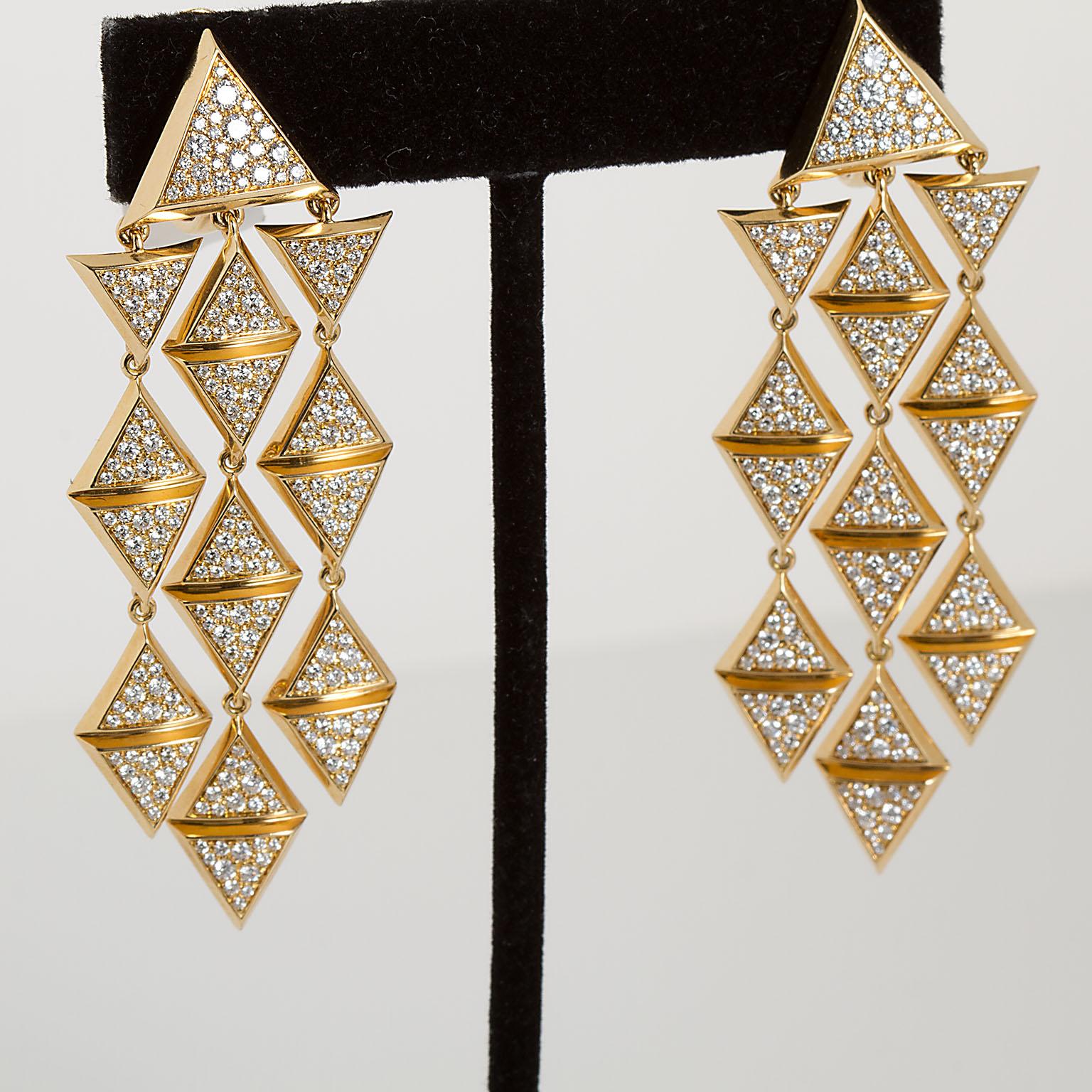 A pair of dangle style earrings in a geometric cascading triangle design by Marina B. Set with 3.45 ctw of round diamonds these hang down 2.75 inches.

No. TMWJ-190506-6
