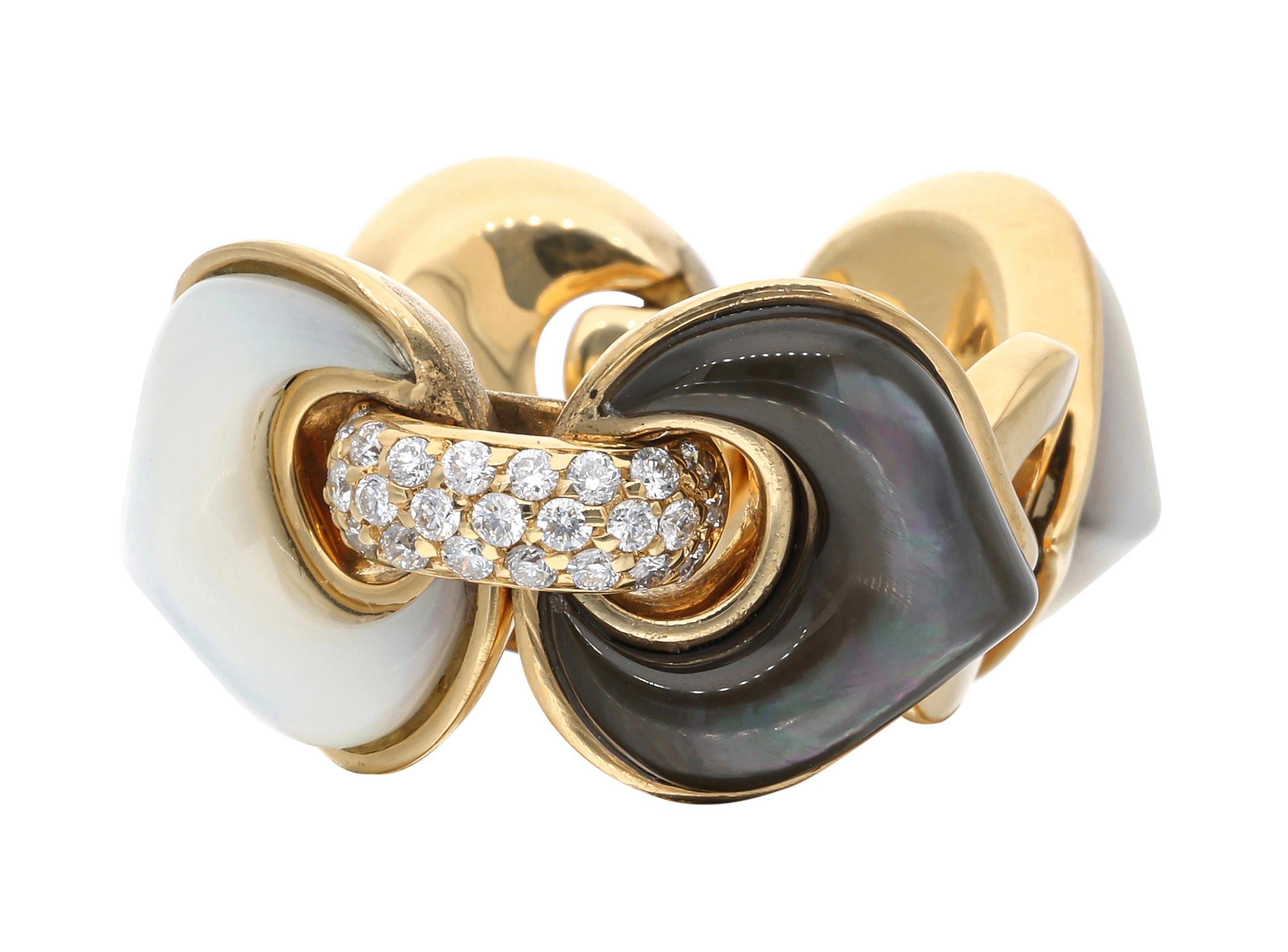 Composed of black and white mother of pearl, accented by round brilliant cut diamonds.

- Diamonds weigh a total of approximately 0.75 carat
- Signed Marina B with serial number
- 18 karat yellow gold
- Total weight 13.13 grams
- Size 8.5

The