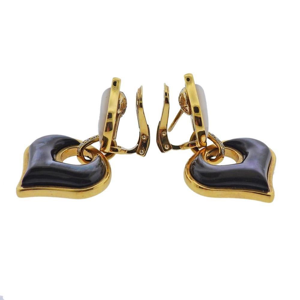Pair of 18k yellow gold earrings by Marina B, set with black and white mother of pearl and approx. 0.14ctw in diamonds. Earrings are 40mm x 25mm. Marked: MB, 2201015, 750. Weight - 24.5 grams. E-03050