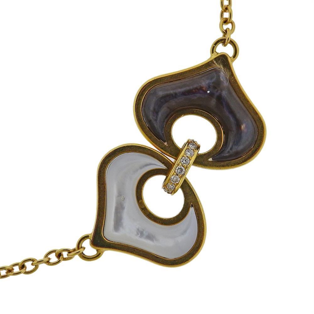 Long 18k yellow gold station necklace by Marina B, featuring links set with white and black mother of pearl and approx. 1.20ctw in diamonds. Necklace is 37.5