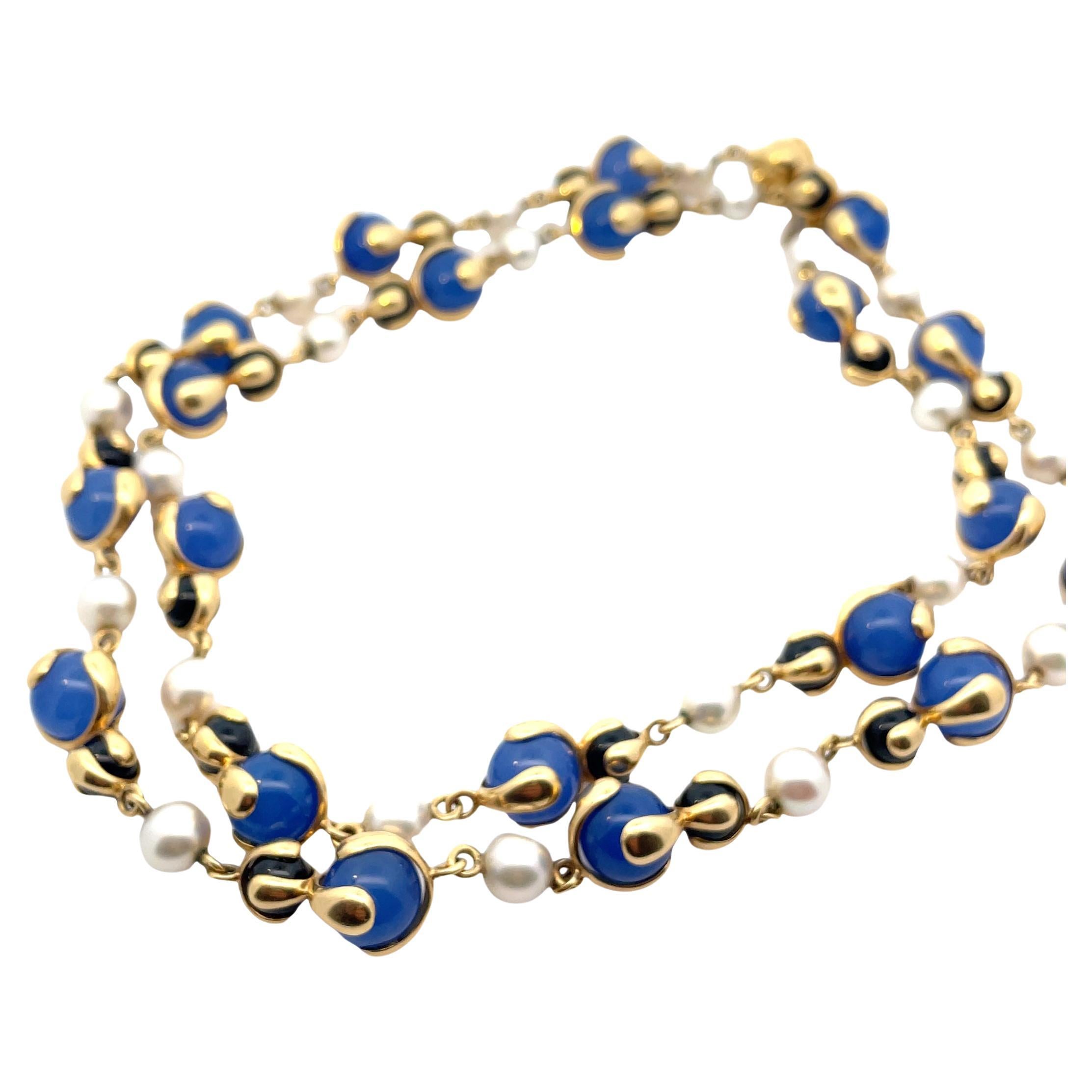Vintage Long 18k gold necklace by Marina B, with 10.5 mm Blue Beads, 7mm onyx and 8mm pearls. Necklace is 84 cm long. Marked: Marina B, MB, Italy, 750. Weight - 131,5 grams.
Please note we have another one in Blue Beads and can be purchase togheter.
