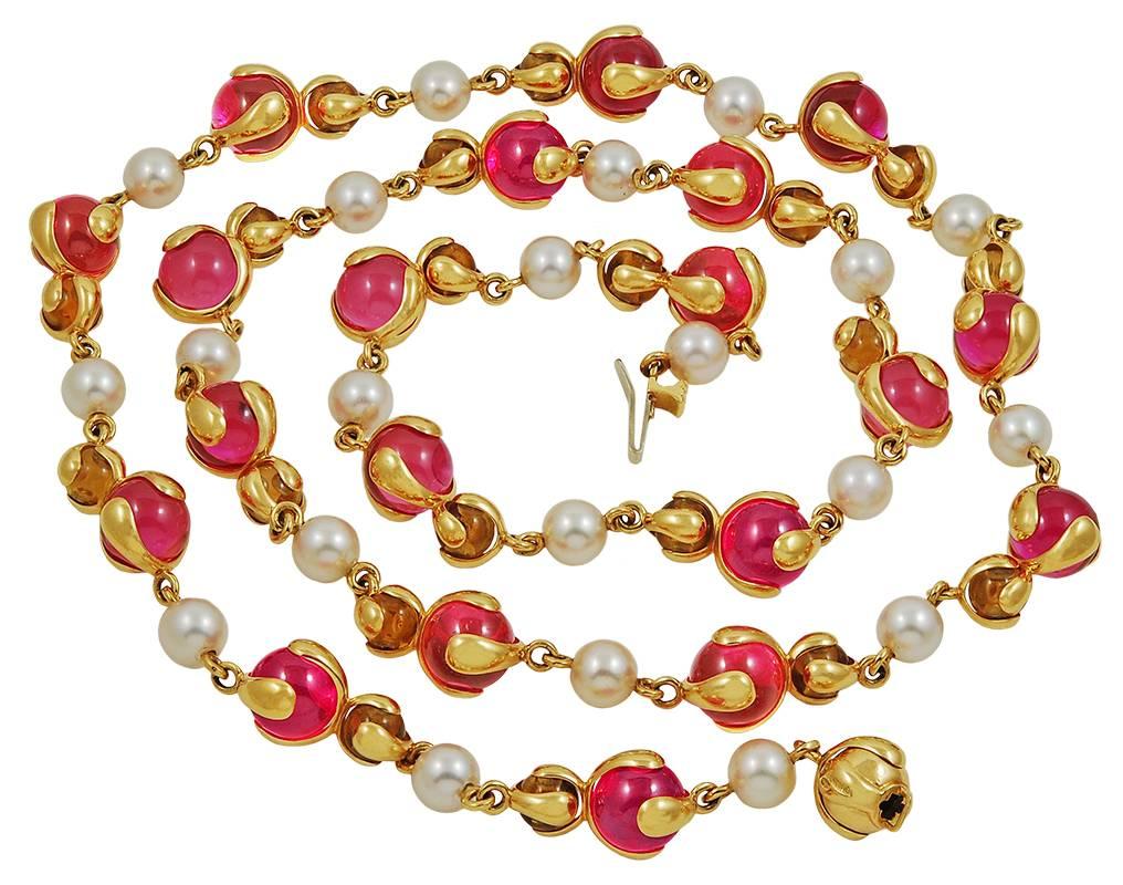 A vibrant piece by Marina B, comprising a long 18k yellow gold necklace impeccably set with an abundance of radiant pink Russian quartz, citrine, and pearl. Can be wrapped as a shorter necklace. 
Signed Marina B. 