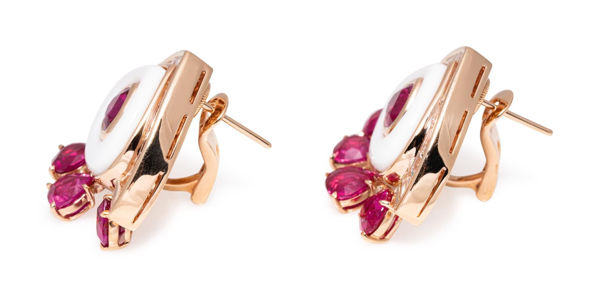 Chic Marina B earclips centering pear-shaped rubies within polished cocholong (white opal) frames, accented by 3.70 carats of baguette diamonds, further suspending fringes of pear-shaped rubies totaling 10.15 carats. 18 karat pink gold, 1 inch long,