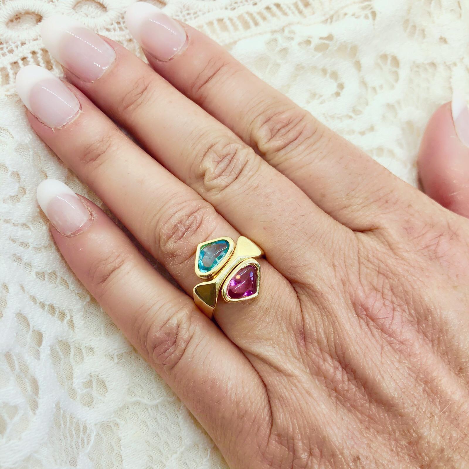 Four rings in one! This unique 18k gold ring set by famed designed Marina B. of the one and only Bulgari family, has 4 interchangeable semi-precious duos in either white or yellow gold, including citrine, tourmaline, amethyst and blue topaz that