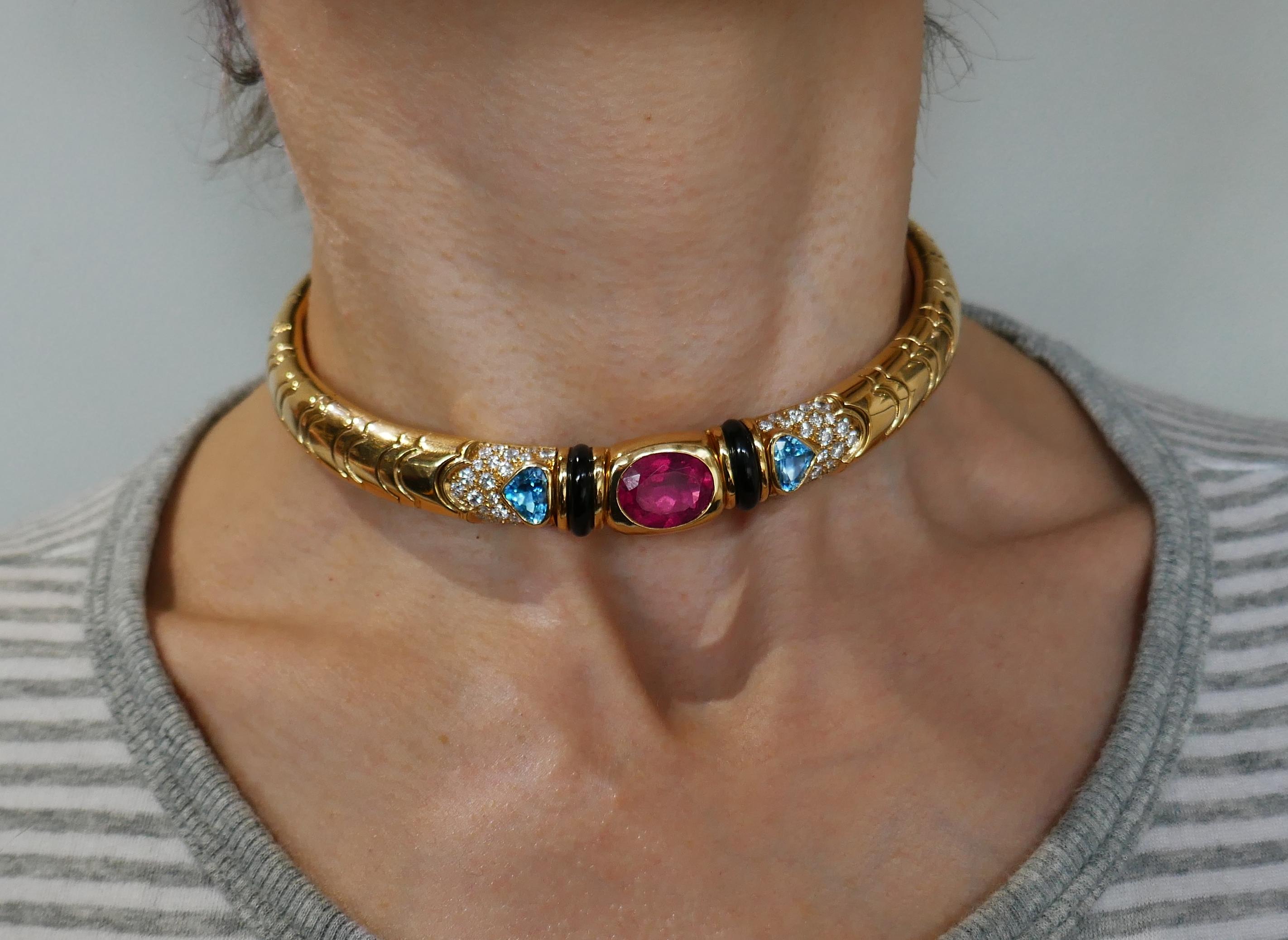 Colorful and chic choker necklace created by Marina B in 1980s. It definitely makes a statement! Elegant and wearable, the choker is a great addition to your jewelry collection. Features a faceted oval-shape pink tourmaline set in 18 karat yellow