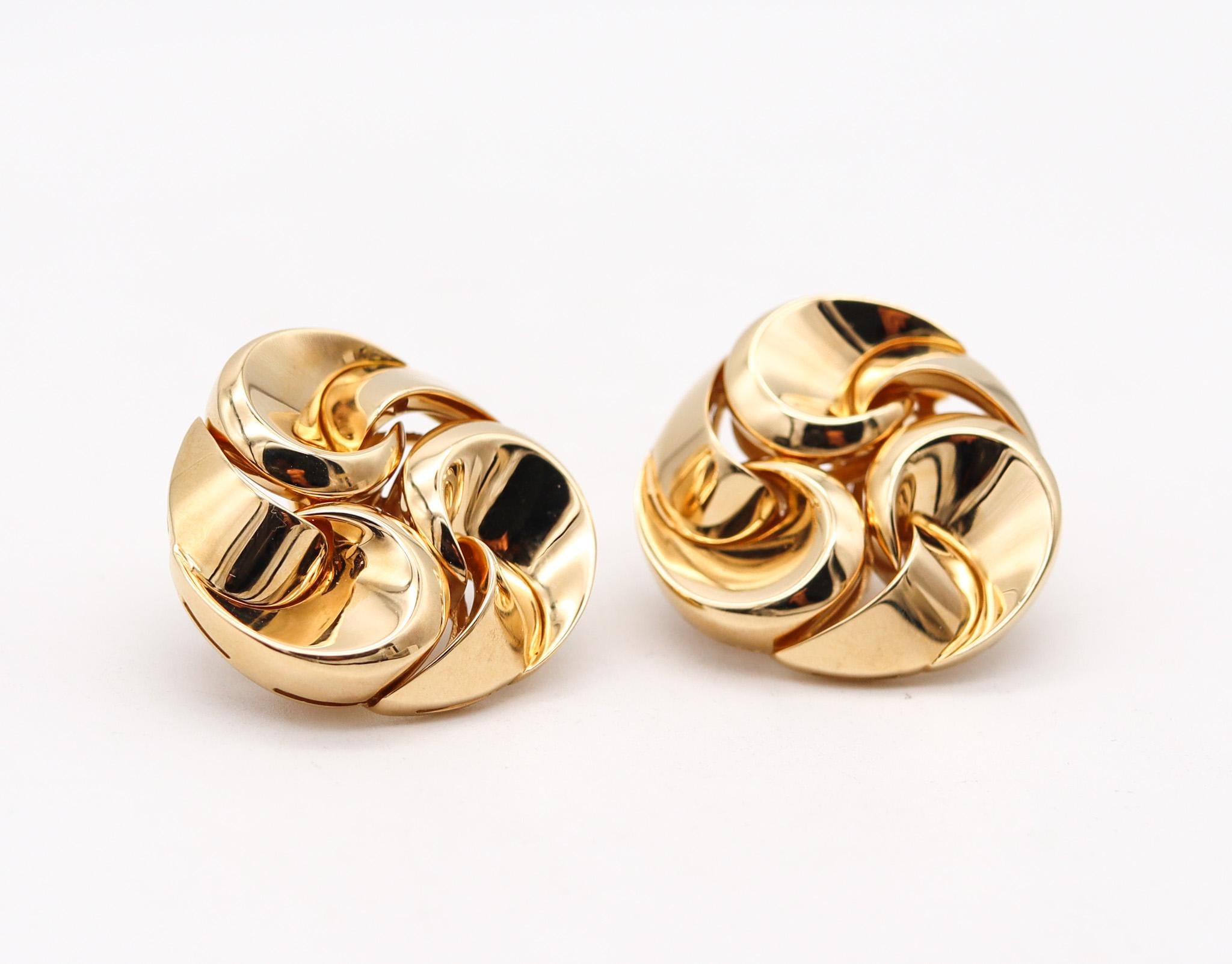 Swirl Vertigo earrings designed by Marina B.

Beautiful swirl pair of ear clips created in Milano Italy by the jewelry house of Marina Bvlgari. back in the 1990's. These free-form geometric earrings are part of the iconic collection named Vertigo.