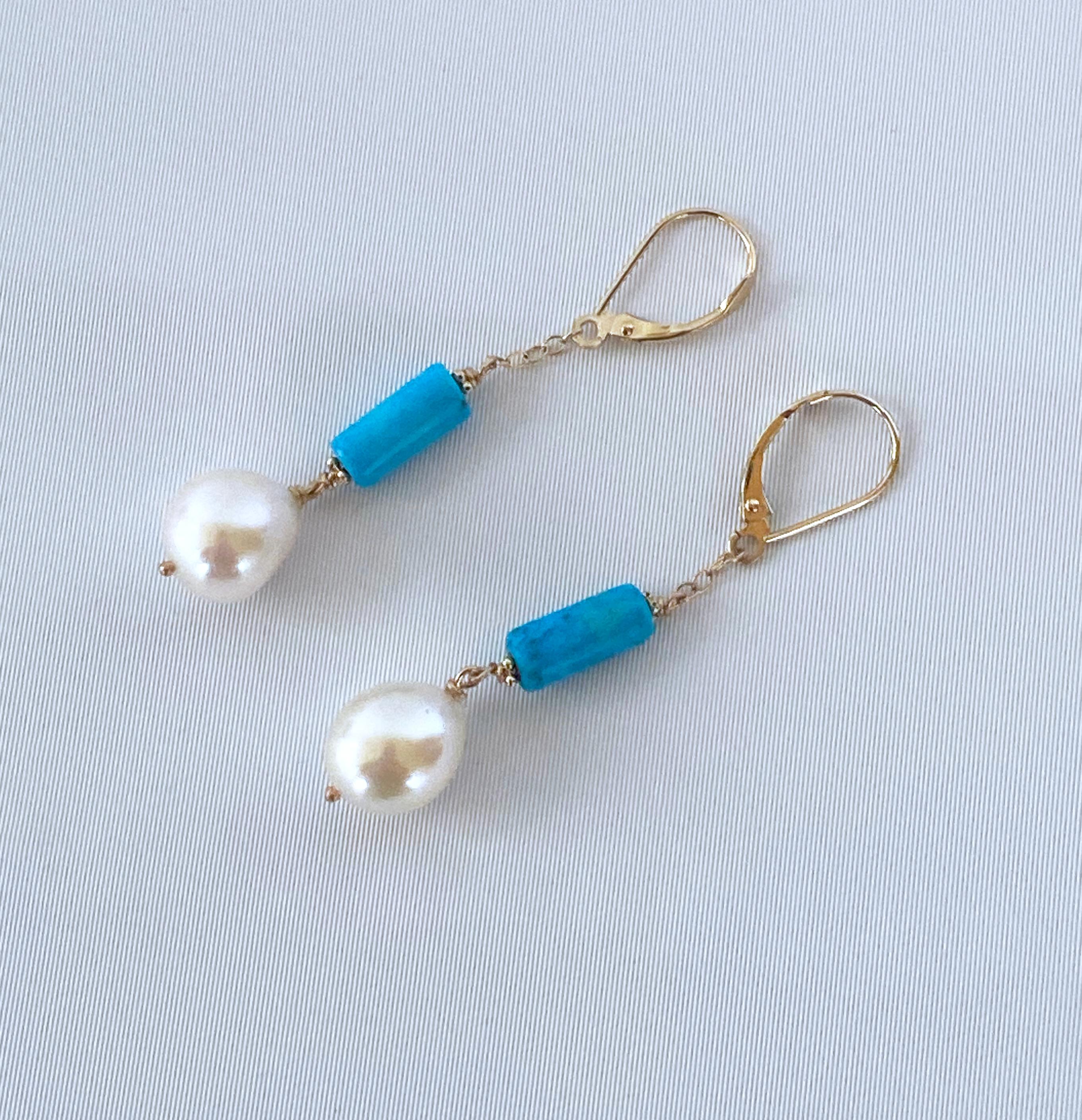Simple yet bold pair of earrings from Marina J. These lovely earrings are made of all solid 14k Yellow Gold Lever Back hooks, chain and wiring. Each Earring features a high luster Pear shaped Pearl hanging from 14k Gold chain beneath a cylindrical,