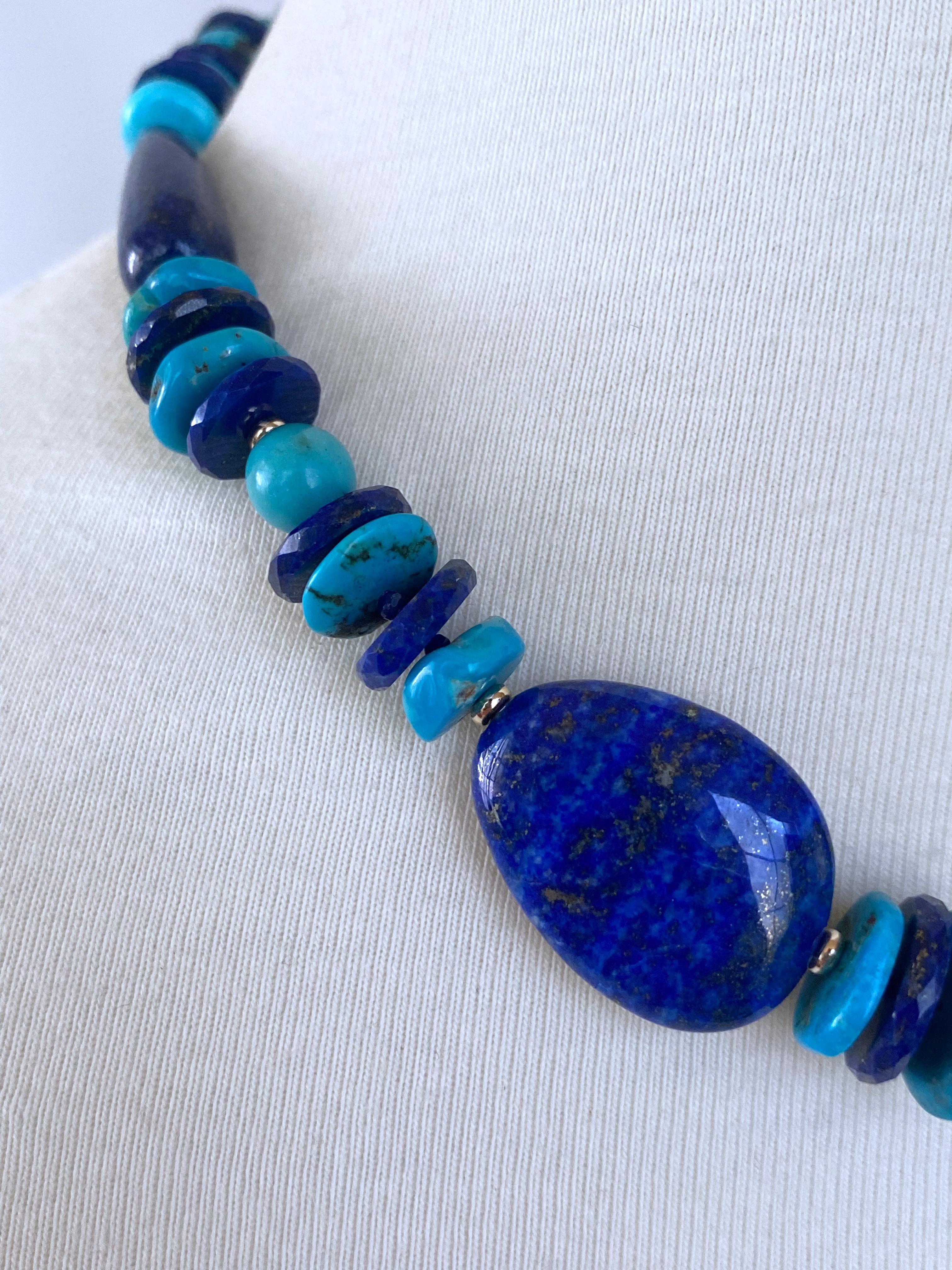 Beautiful multi shaped and multi colored necklace by Marina J. This piece features gorgeous Turquoise and Lapis Lazuli stones all adorned by solid 14k Yellow Gold beads throughout. Measuring 17.25 inches long, this necklace meets at a solid 14k