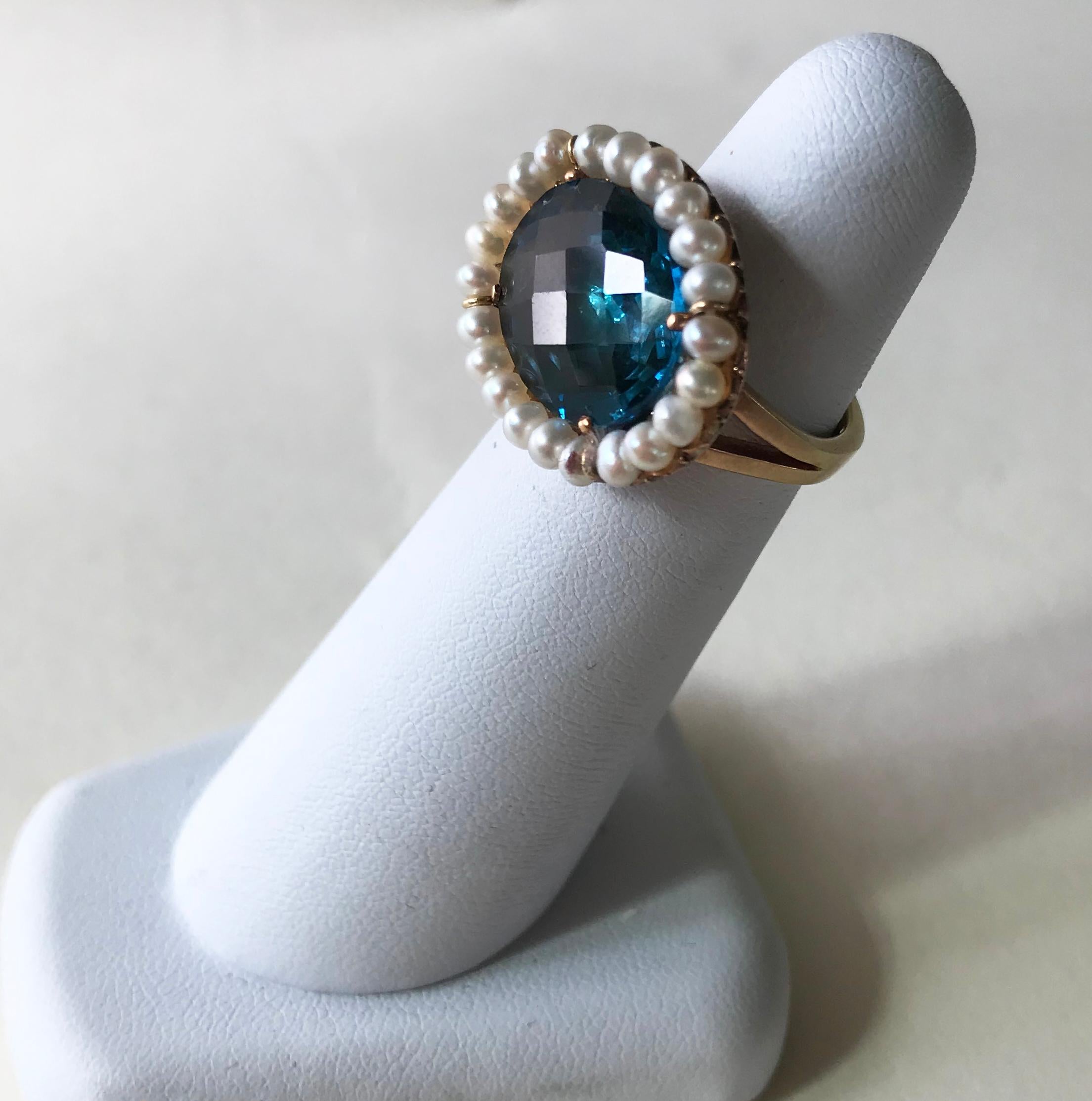 Marina J. designed this beautiful 18 Karat Yellow gold ring with London Blue Topaz Stone and Pearls for the elegant and dazzling woman, making this a substantial ring to wear, impressive but not overpowering, a definite eye-catcher, which you can be