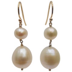 Marina J. Boucles d'oreilles en or avec perles blanches de 6 et 11 mm
