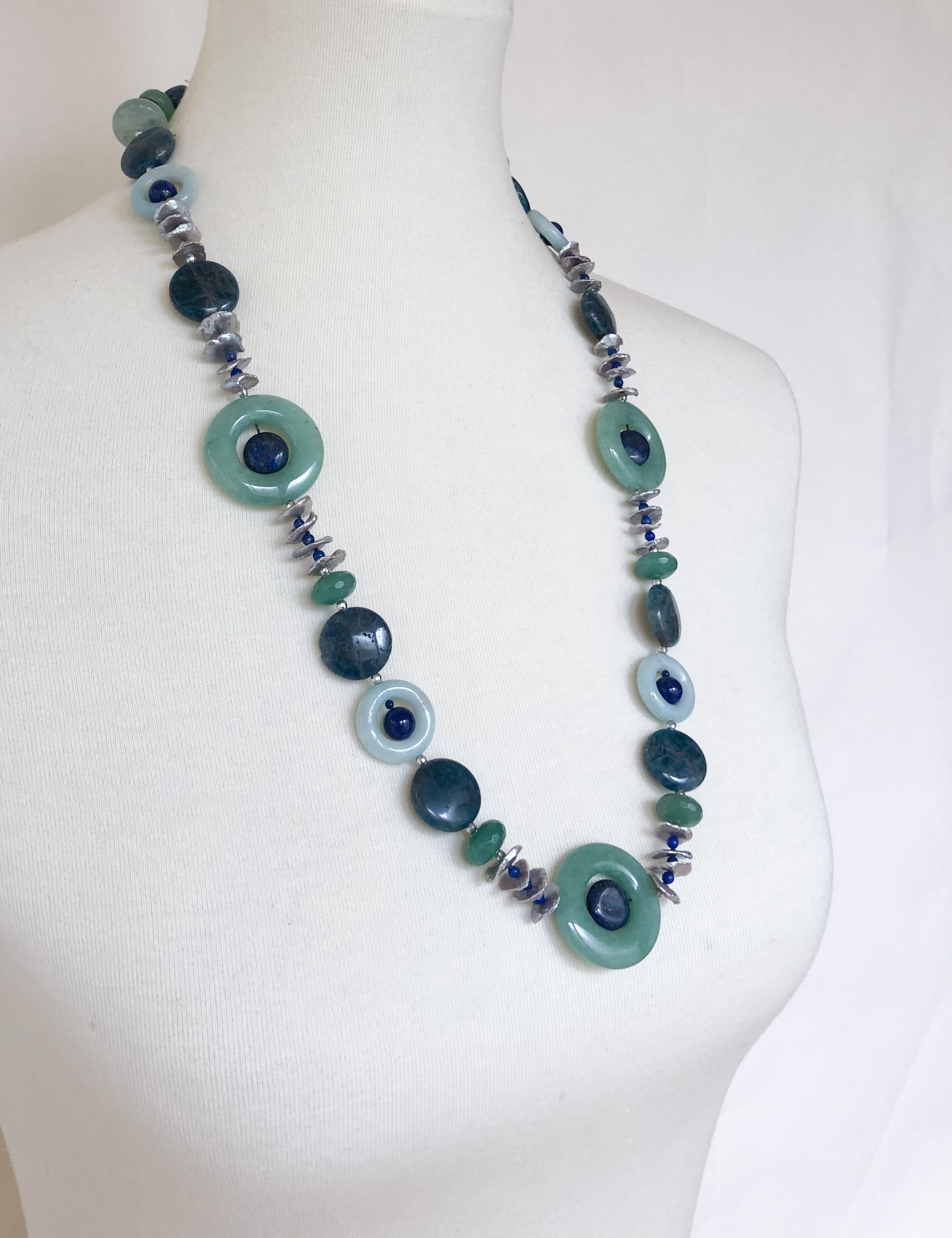 Great stone necklace by Marina J. This amazing piece is made using multi shaped Adventurine, Appatite, Amazenite, Bumorite and Lapis Lazuli. Irregular shaped Freshwater Grey Pearls and small Rhodium plated Silver disco beads (which vividly catch and