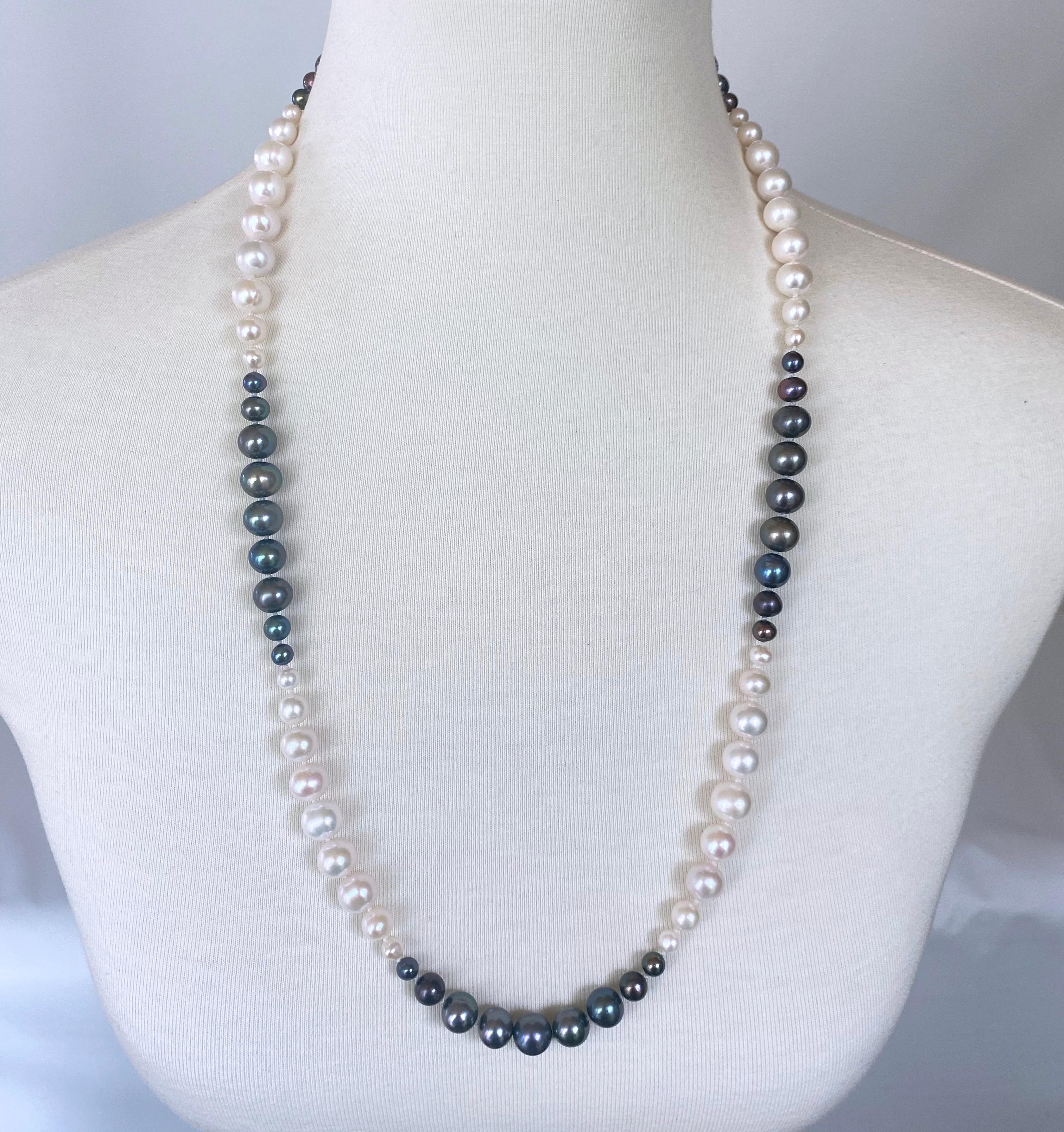 Gorgeous strung Pearl Ombre necklace by Marina J. This beautiful piece features all Cultured White and Black Pearls all strung together with multiple size Graduations. The Pearls displays a wonderful sheen to them and all Black Pearls feature a