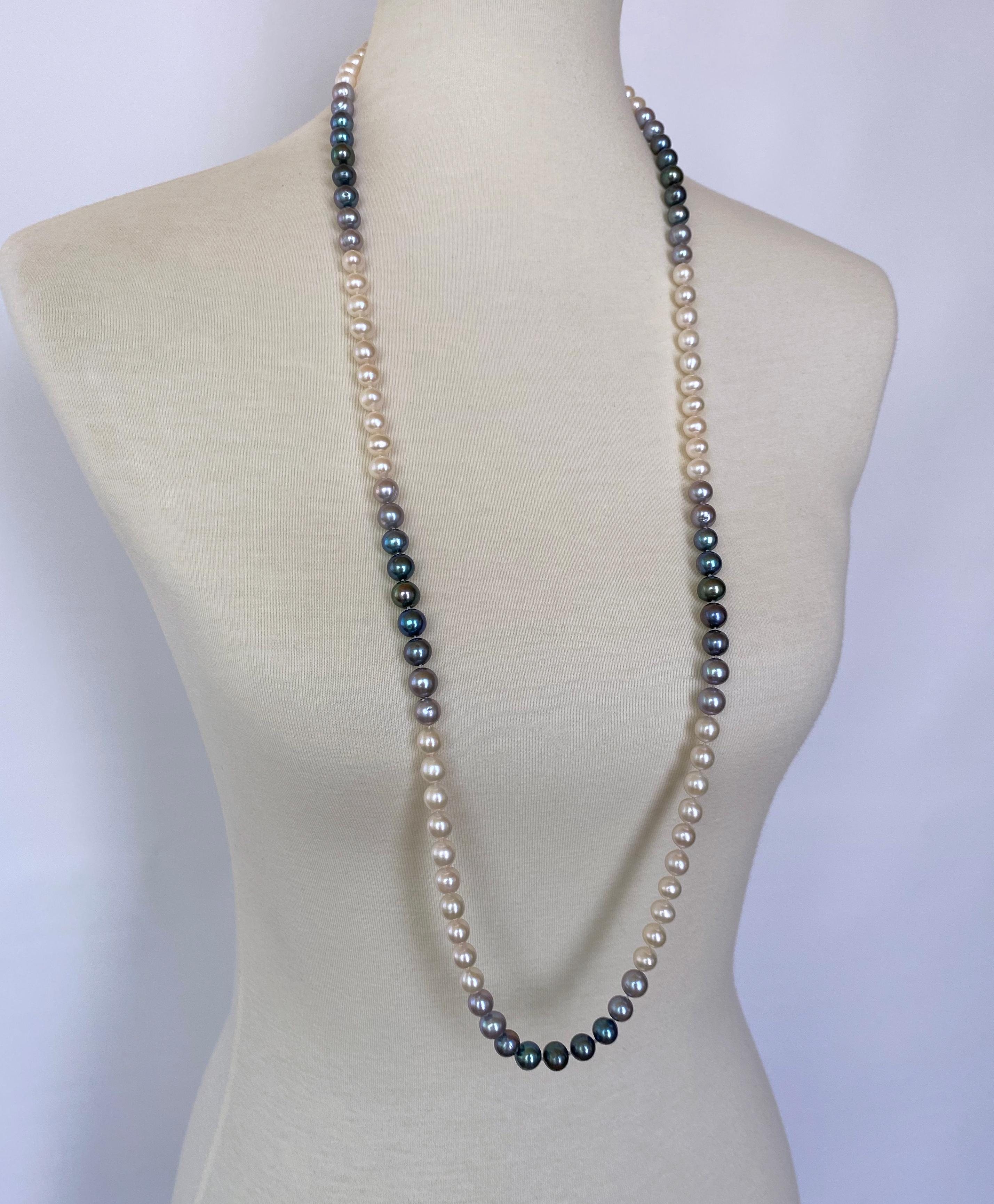 Gorgeous long woven Pearl Ombre necklace by Marina J. This beautiful piece features all Cultured White, Grey and Black Pearls which display radiant iridescence; and has 4 strung graduations of Gradients woven throughout. Measuring 39 inches long,