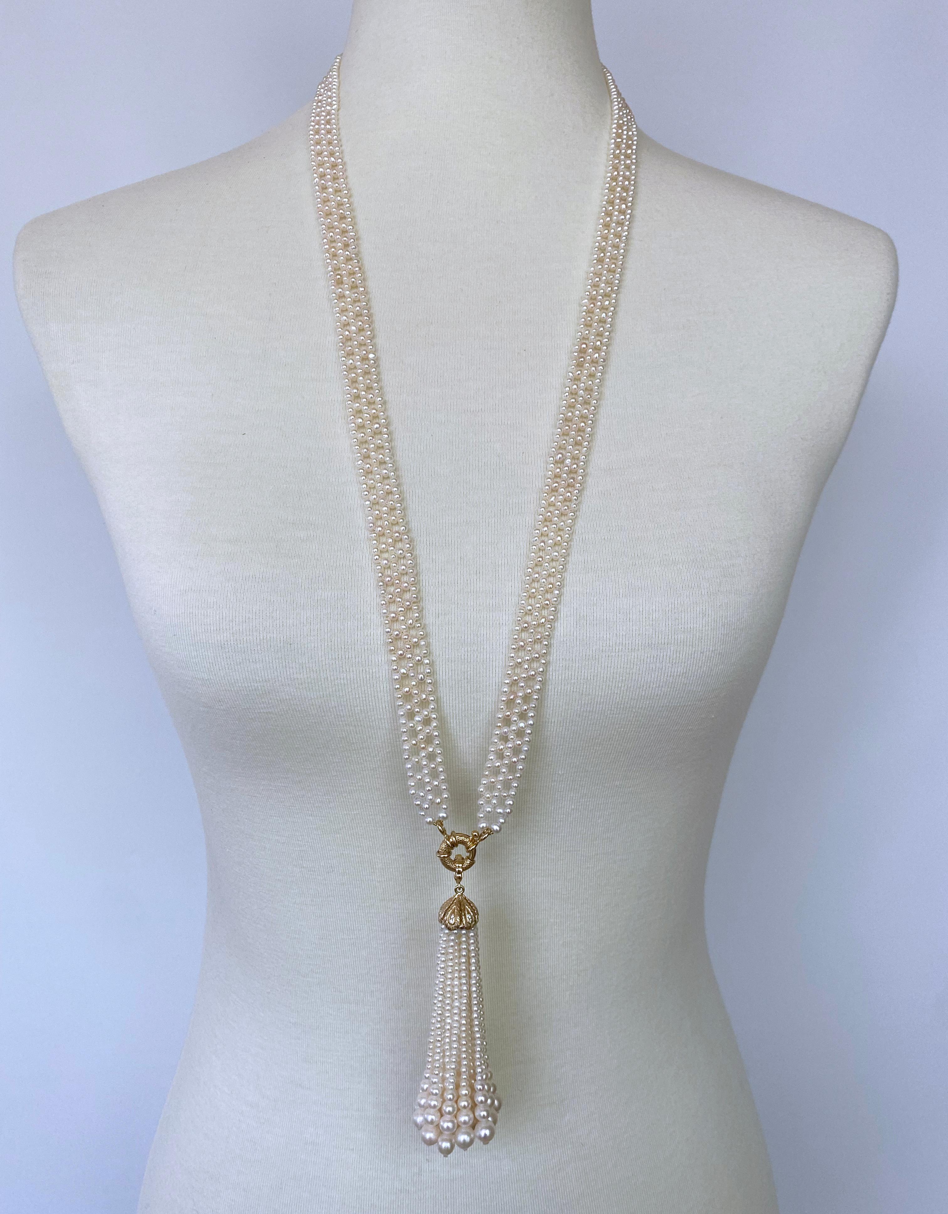 Beautiful piece made by Marina J. This Sautoir features all white Pearls which display a vivid iridescent sheen; intricately woven into a fine, lace like design. Measuring 33 inches long sans Tassel, this Sautoir meets at stunning a solid 14k Yellow