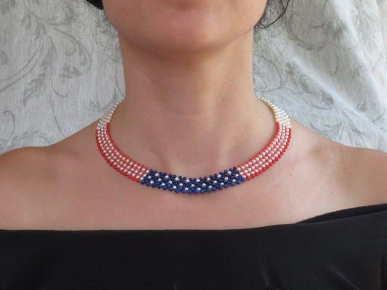 This American flag woven pearl, coral, and lapis lazuli, the necklace is designed by Marina J for your 4th of July festivities. Woven together are 2.5-3 mm beads of pearls, coral, and lapis lazuli to create this marvelous and patriotic American flag