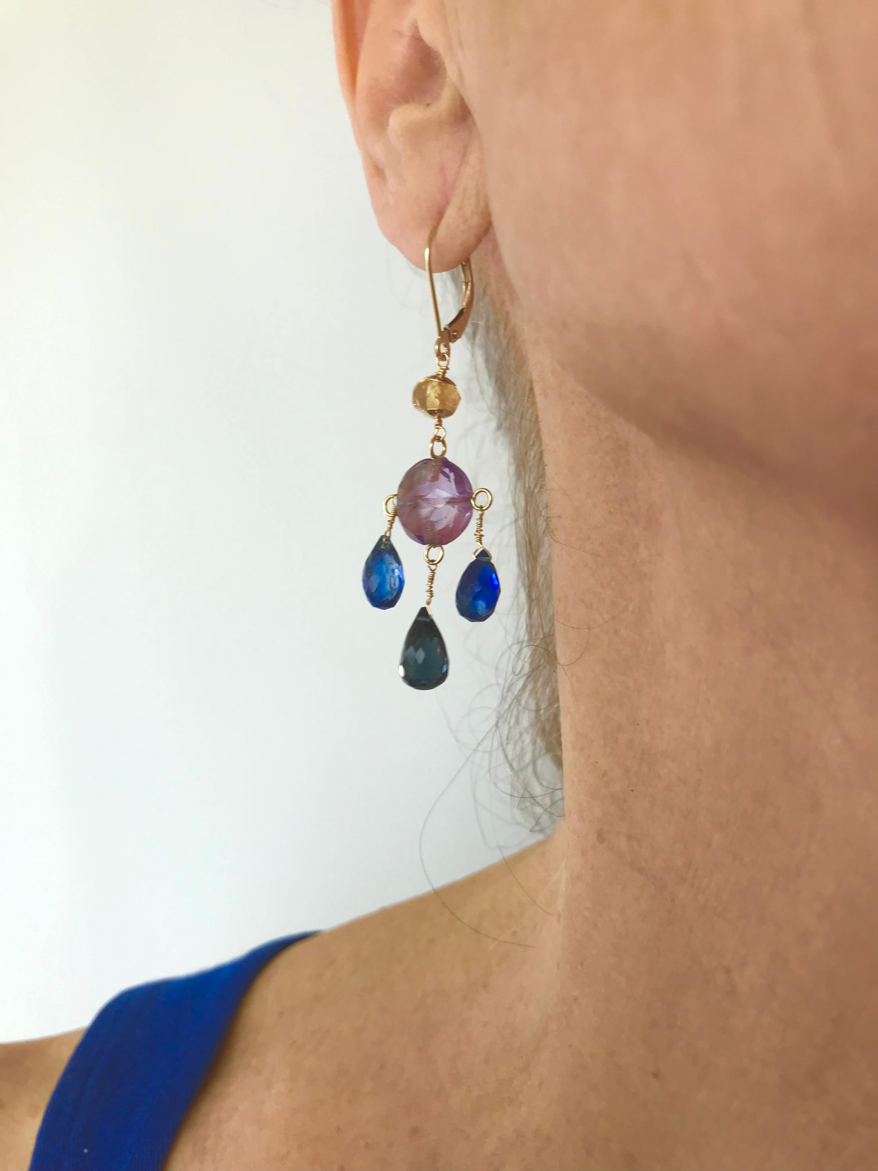 Gorgeous pair of small Chandelier Earrings by Marina J. This colorful pair features a beautiful Amethyst center bead from which two small bright Blue Kyanite teardrop Briolettes hang, and a larger, deep London Blue Topaz teardrop Briolette hangs