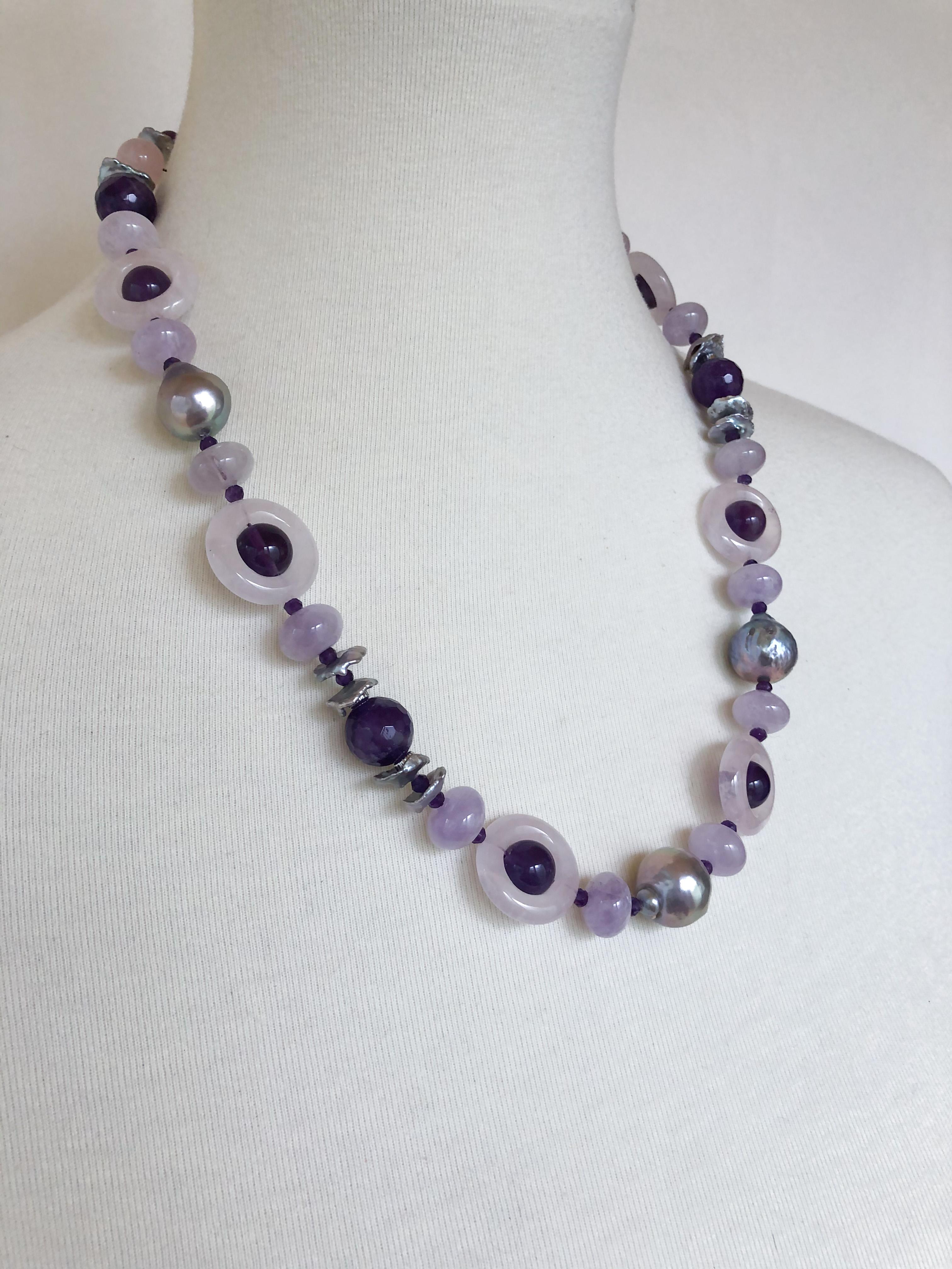 Beautiful stone necklace by Marina J. This lovely piece is made using multi shaped faceted Amethysts and Rose Quartz all adorned by 14k White Gold plated Silver Vermeil findings & Freshwater Grey Pearls which display a vivid sheen and iridescence.