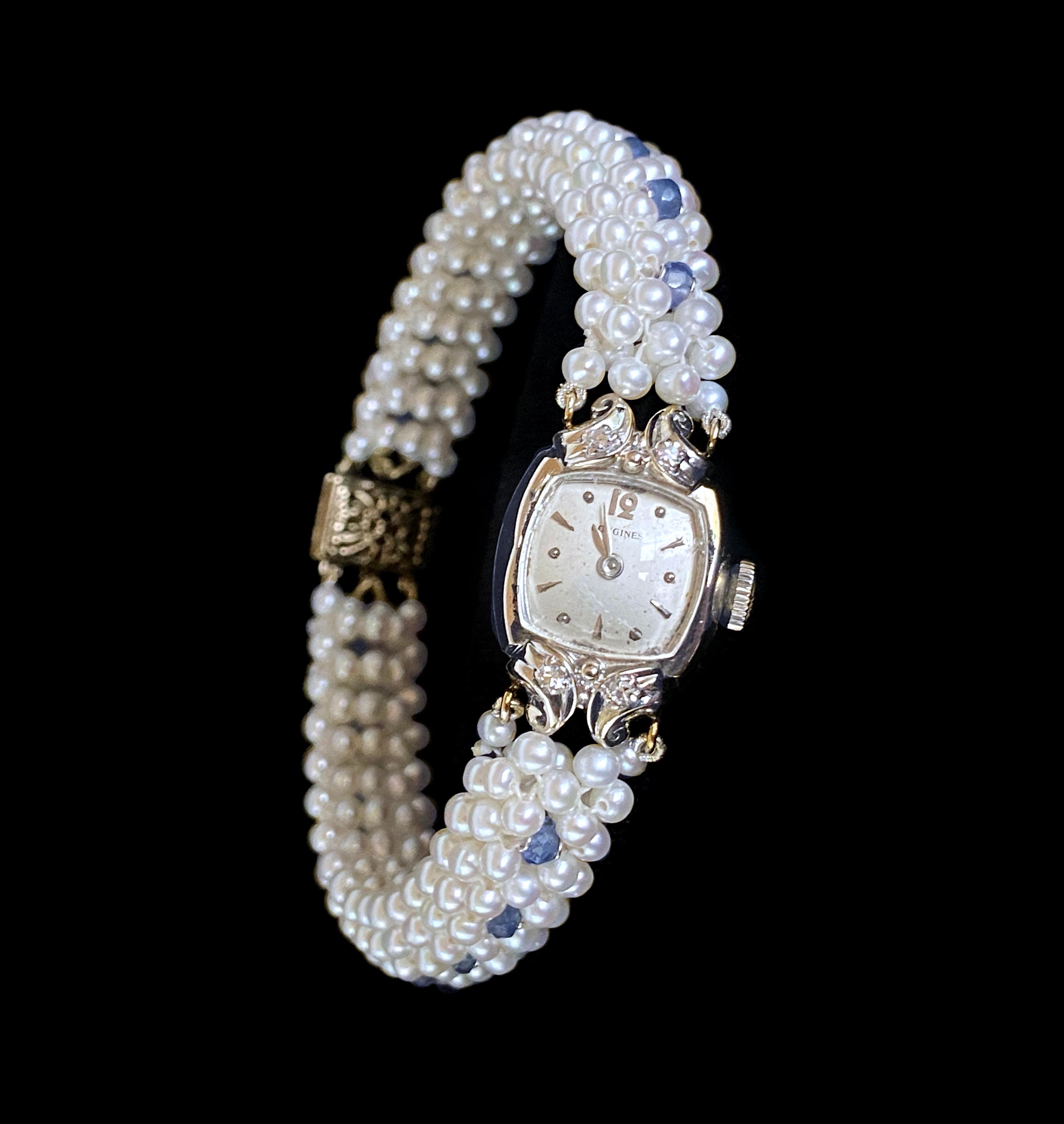 Gorgeous One of A Kind by Marina J. This piece features a stunning Antique Longines Diamond encrusted working Watch stamped 14k Gold on the back - reworked into an amazing Pearl and Blue Sapphire woven band. Watch includes its original 4 Cushion cut