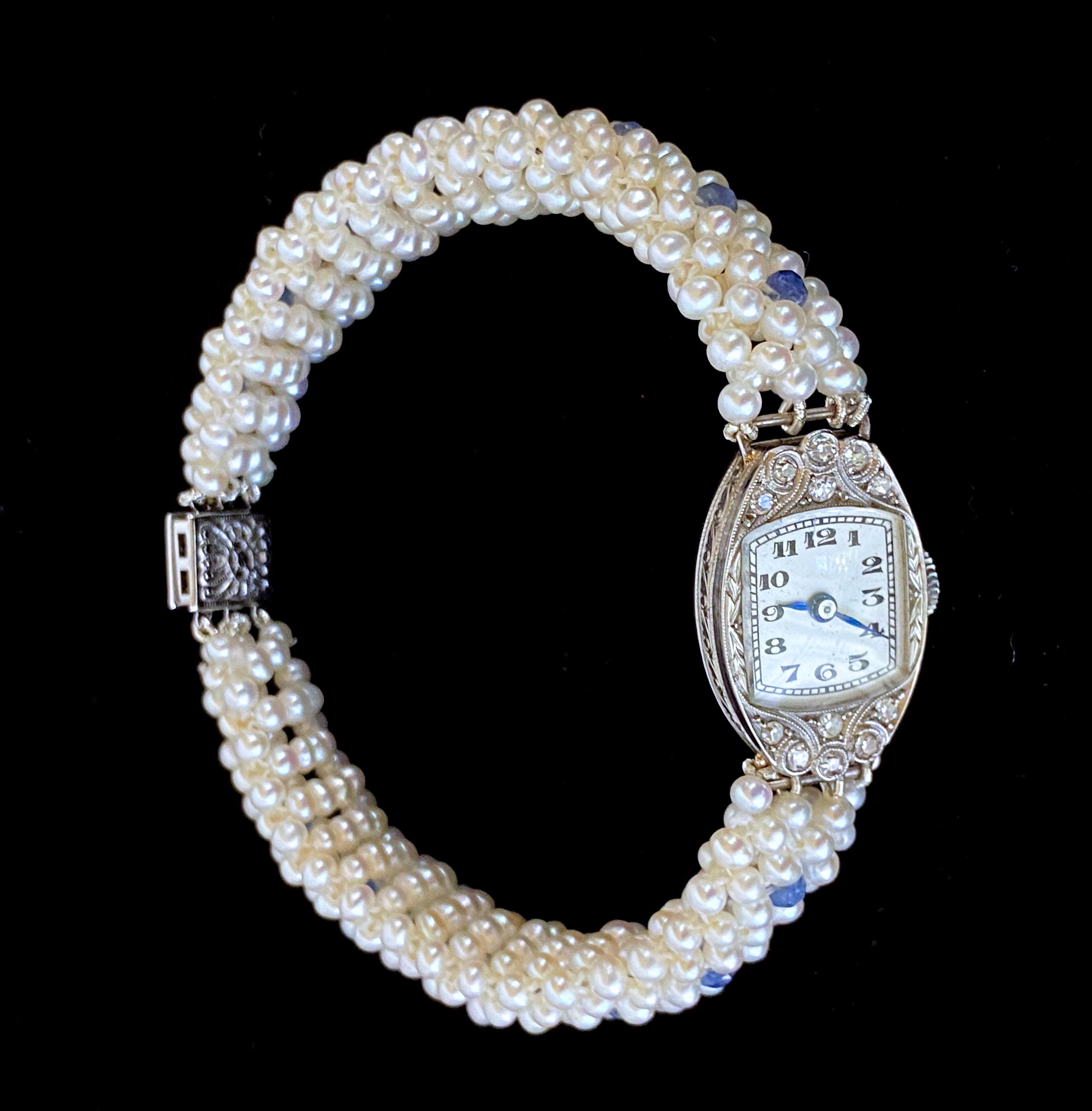Beautiful One of A Kind piece by Marina J. A vintage working manual Diamond studded French Platinum watch is reworked into a gorgeous Pearl and Sapphire bracelet - marked M.E.W. 8-1-55 on the back as shown in photos. This unique watch piece features
