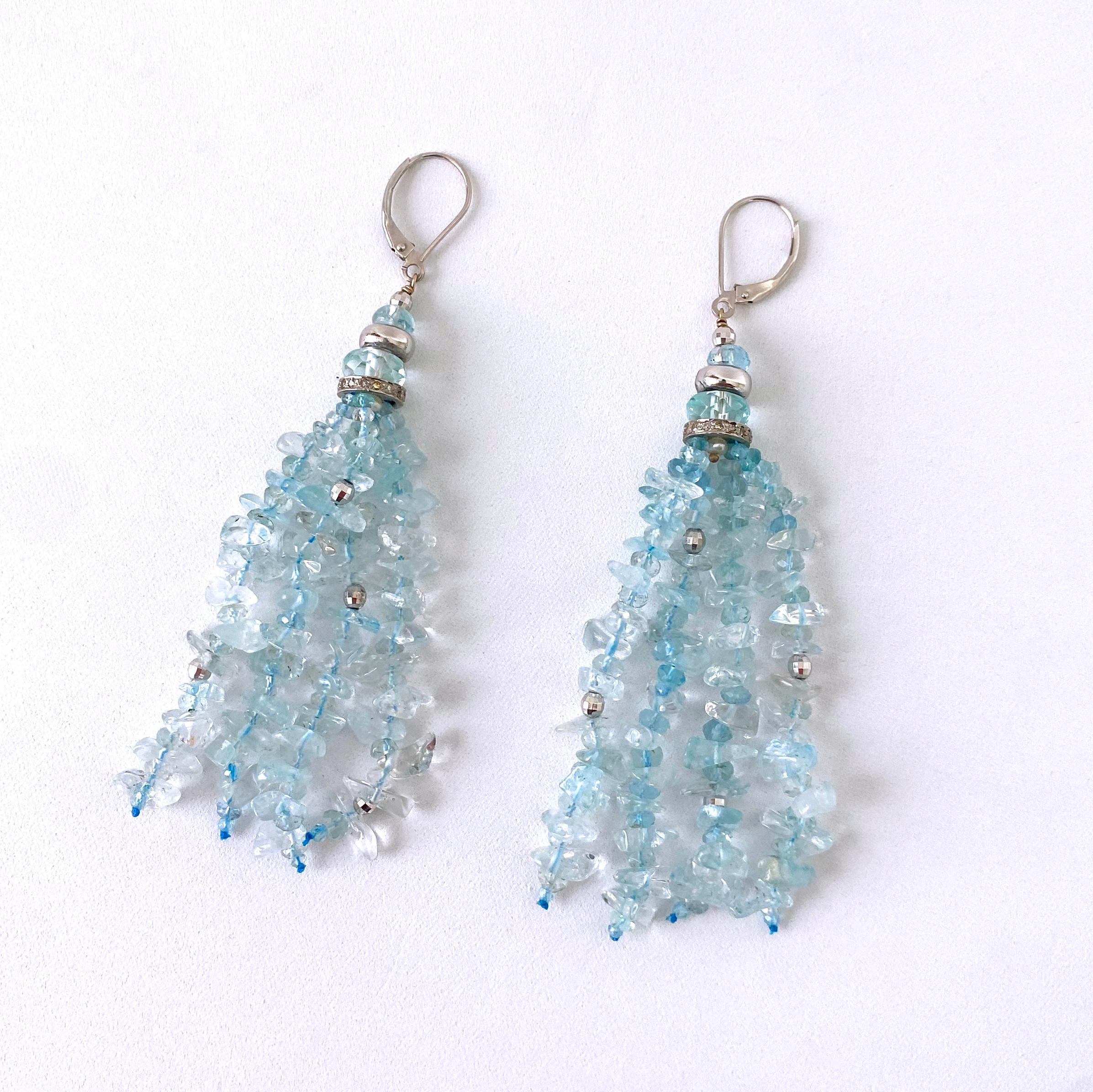 Beautiful pair of Earrings by Marina J.
Measuring 3.5 inches long, this pair hangs off solid 14k White Gold Lever Back Hooks. These Earrings are made with all Rhodium plated Silver, Aquamarine and Diamonds. Four alternating faceted Aquamarine &