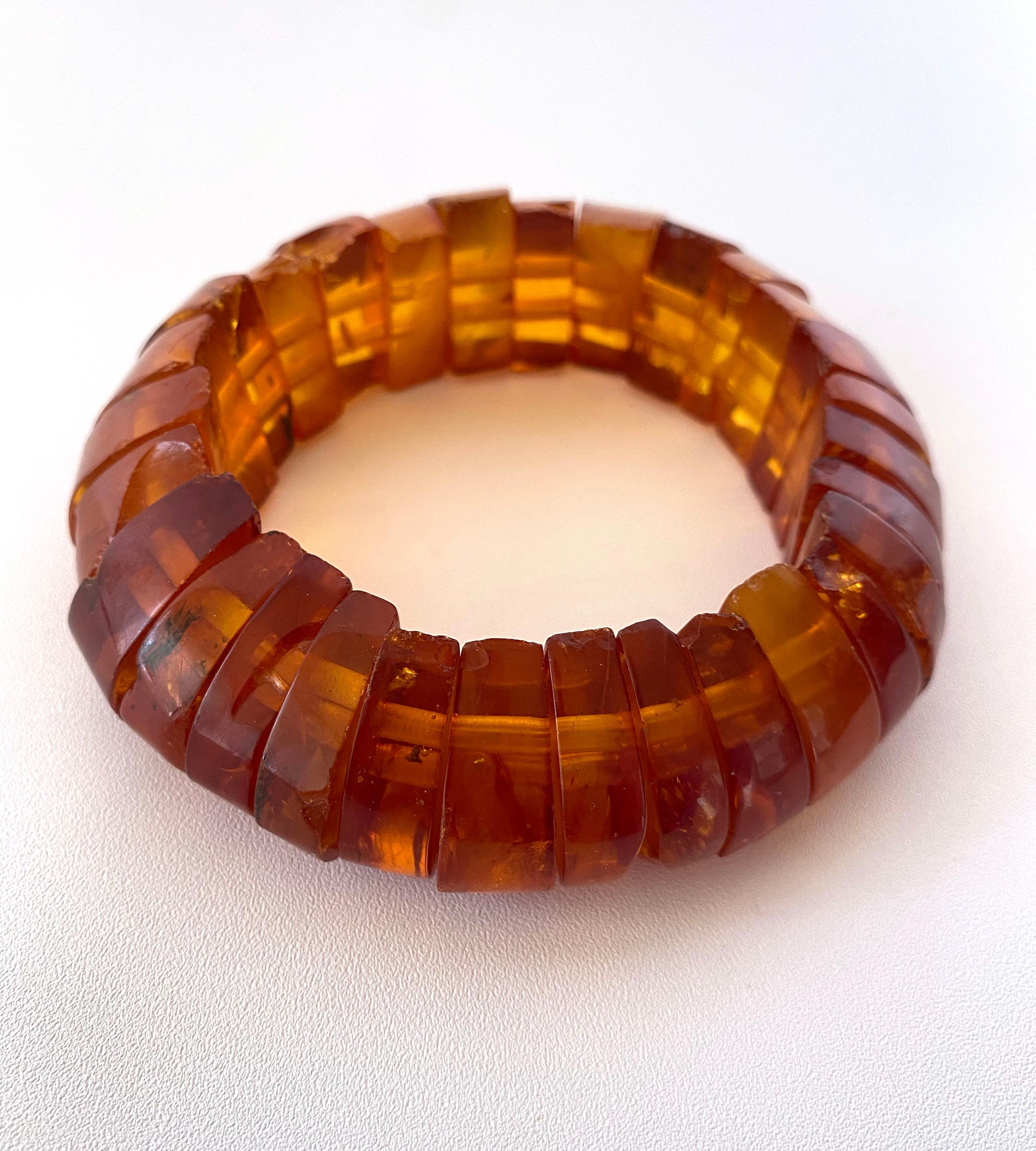 Beautiful and simple bracelet made with all Baltic Amber. Composed of individually cut pieces, this bracelet features perfectly matching and uniform Amber beads for a harmonious 1970s infinity look. Baltic Amber radiates gorgeous moments of Orange,