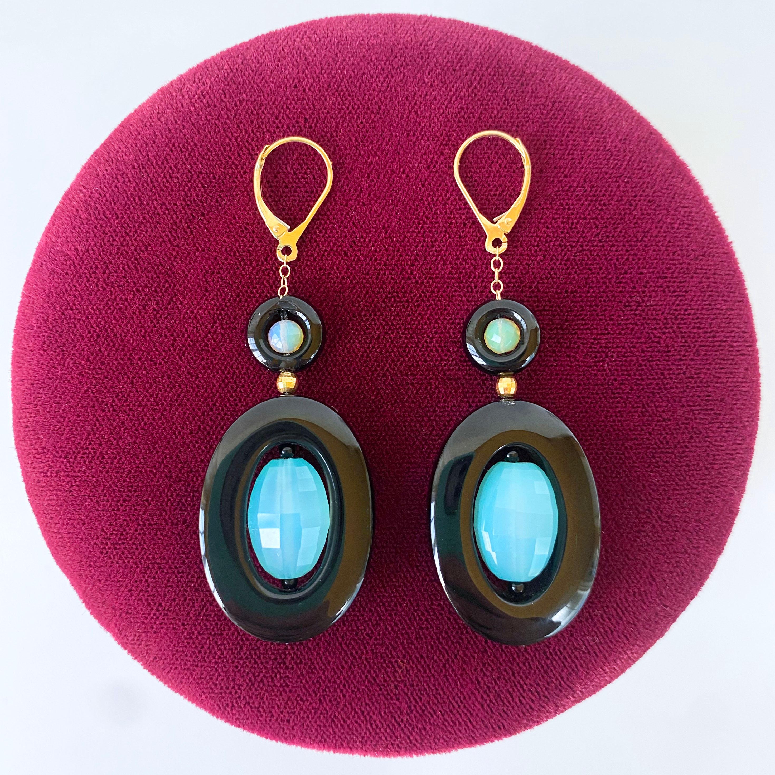 Gorgeous pair of Dangle Earrings by Marina J. This pair is made with all solid 14k Yellow Gold Hooks, Wiring and Chain. This pair features two Black Onyx donuts filled with a Faceted Fire Opal & Faceted Aqua Apatite, separated by a Faceted Solid 14k