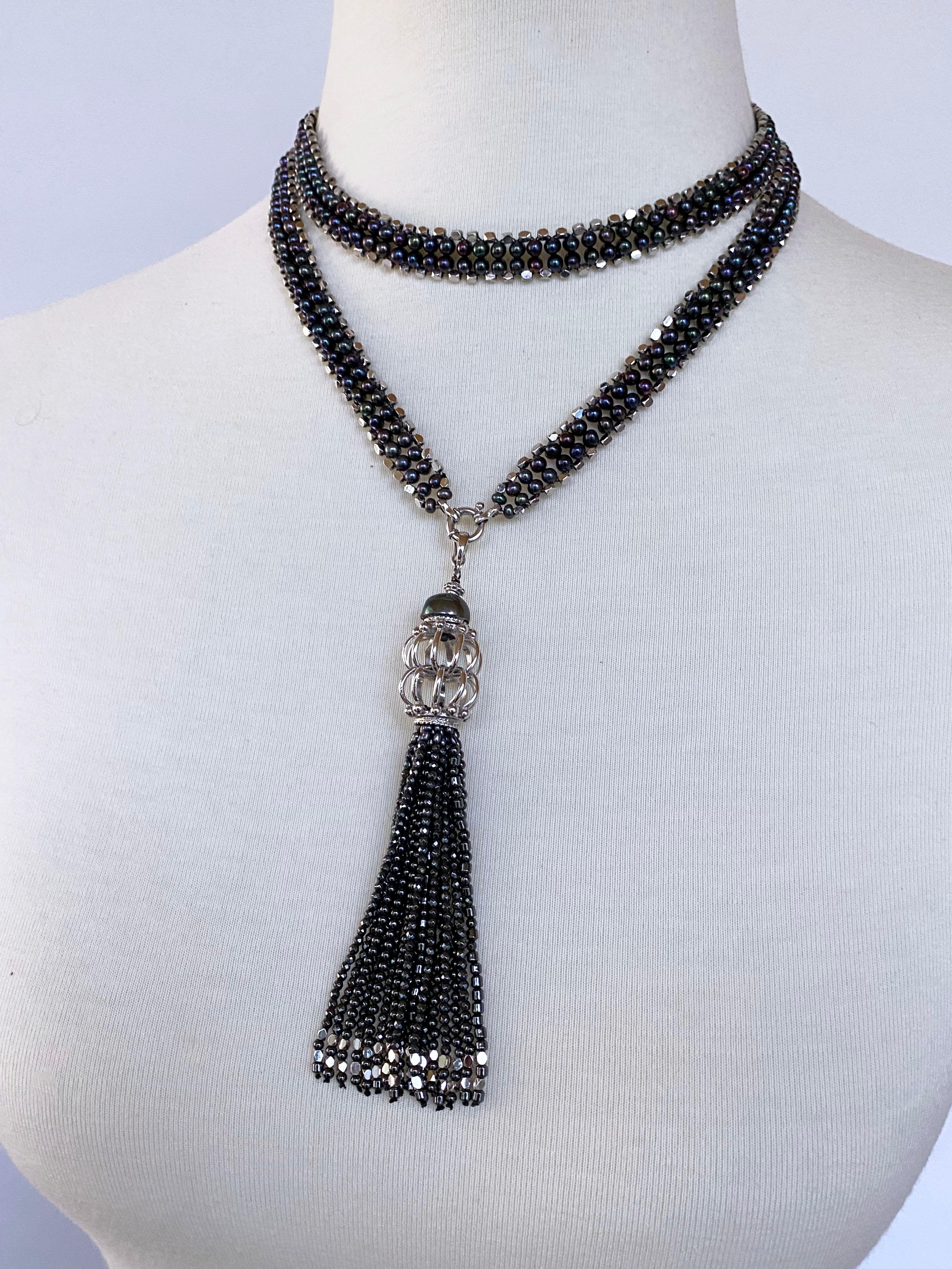 Amazing unisex piece by Marina J. This double stranded Sautoir is made of all Black Pearls and geometric faceted Silver Beads woven together into a double column pattern. The Black Pearls display a multicolor 