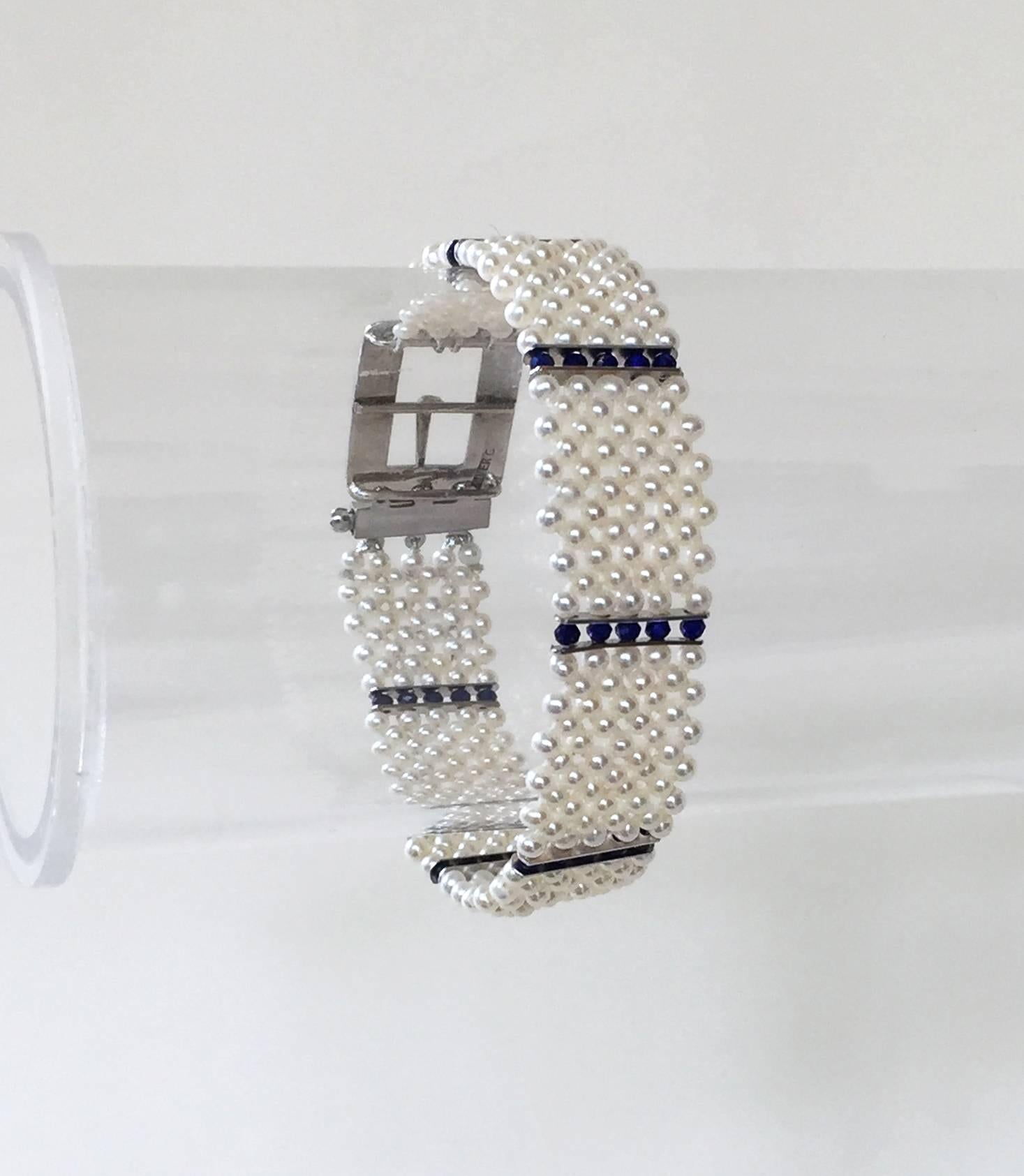 This delicate , yet strong and sturdy bracelet gracefully sits on the wrist. With an elegant and re-enforced weave of the finest white pearls accented by lapis lazuli faceted beads and 14k white gold dividers, the bracelet has a striking design. The