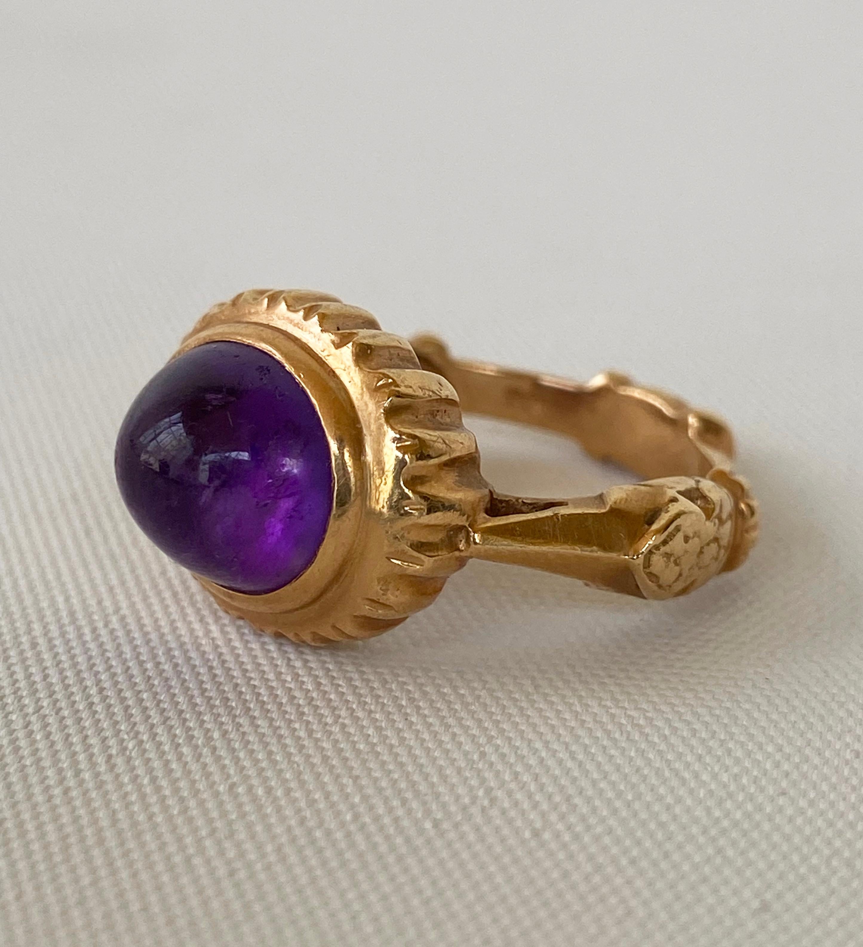 Unique and elegant custom ring by Marina J. This amazing decorative ring is cast with all solid 14k Yellow Gold, and stamped as so on inside the band. This ring features a stunning dome shaped Amethyst that is bezel set into the sun like