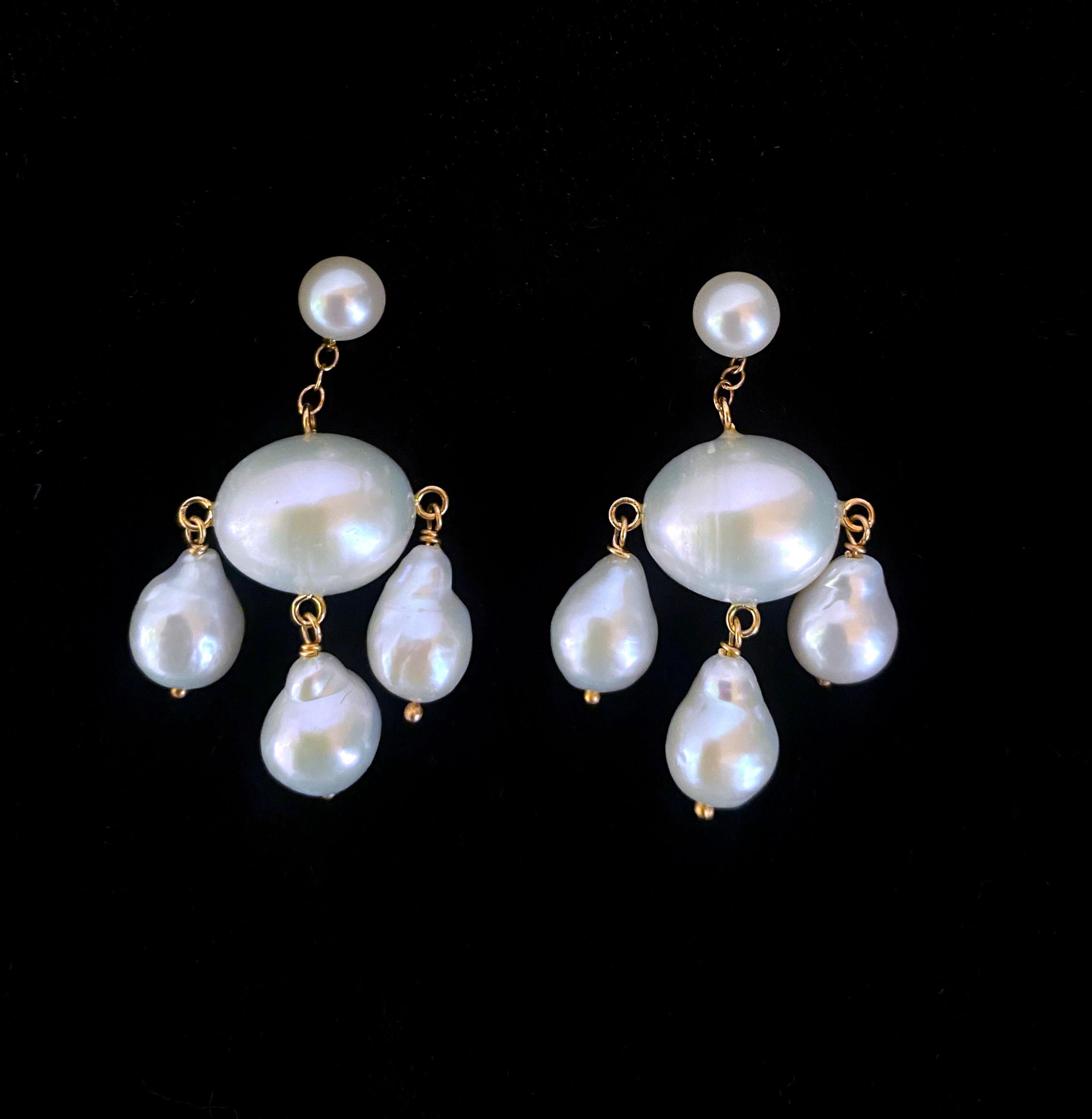 Classic pair of Marina J. Chandelier earrings. This lovely pair is made entirely of high luster white Baroque Pearls which display a vivid iridescence. Three teardrop Pearls dangle from an oval shaped Baroque Pearl bead, created entirely with 14k