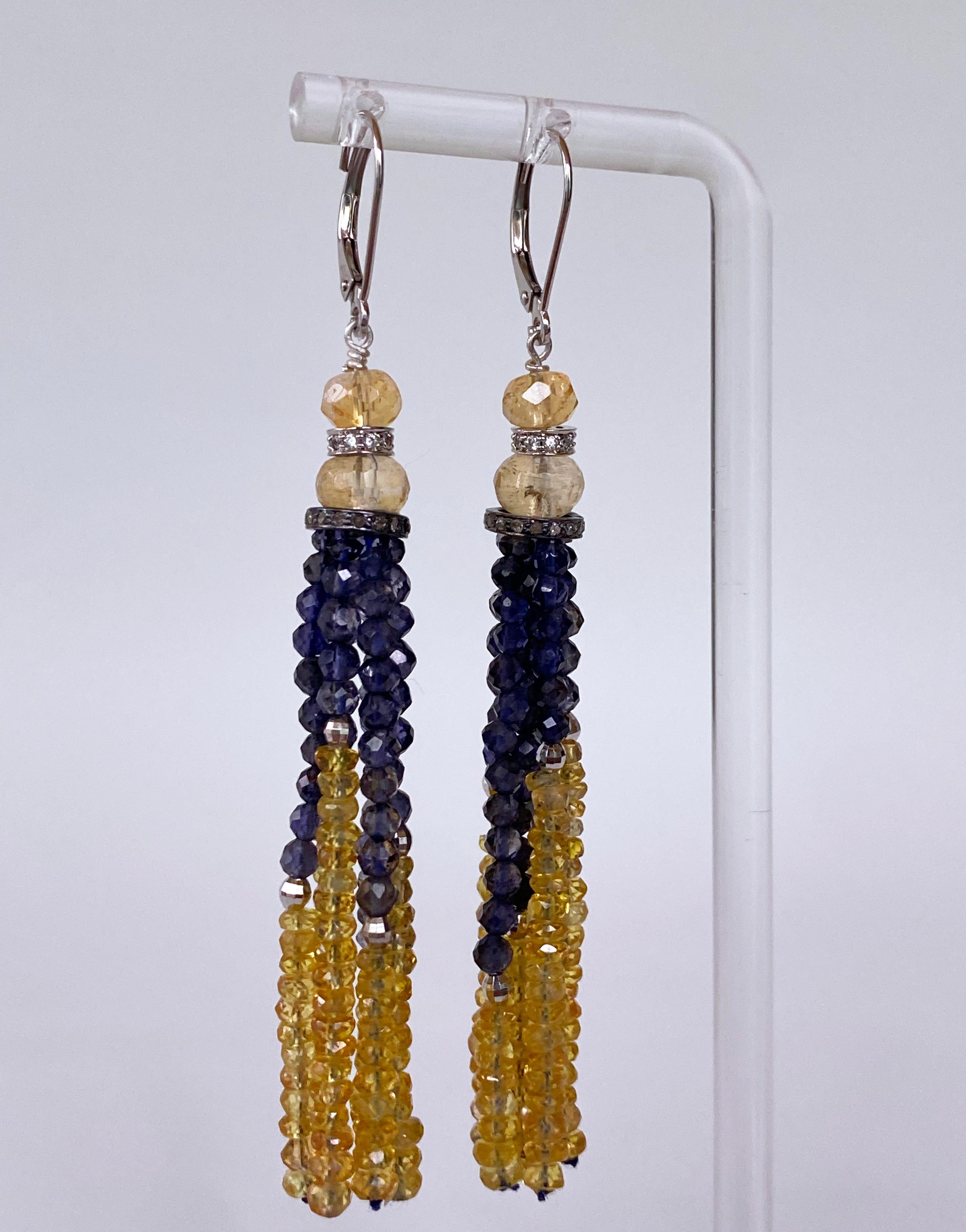 Gorgeous pair of Tassel Earrings by Marina J. This lovely pair features Faceted Citrine and Faceted Iolite. A gorgeous vivid Golden Citrine sits atop a Cushion cut Diamond encrusted solid 14k White Gold roundel which sits above a larger Faceted