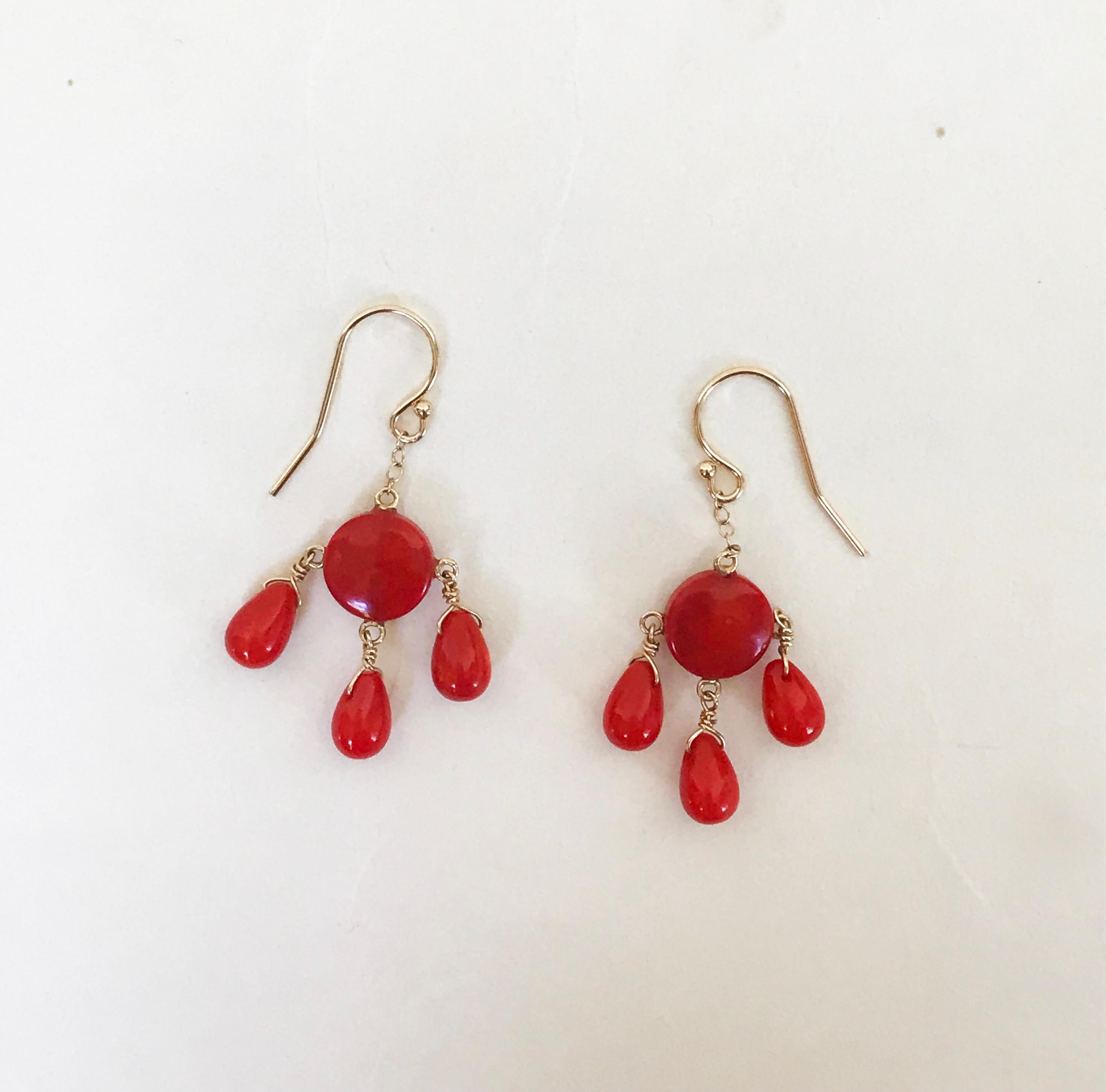 Marina J. presents these beautiful coral earrings with 14k yellow gold wiring and hook. The earrings are striking with the rich red coral drop beads. Highlighting the stones are 14k yellow gold wiring and hook. The earrings hang at 1.5 inches to