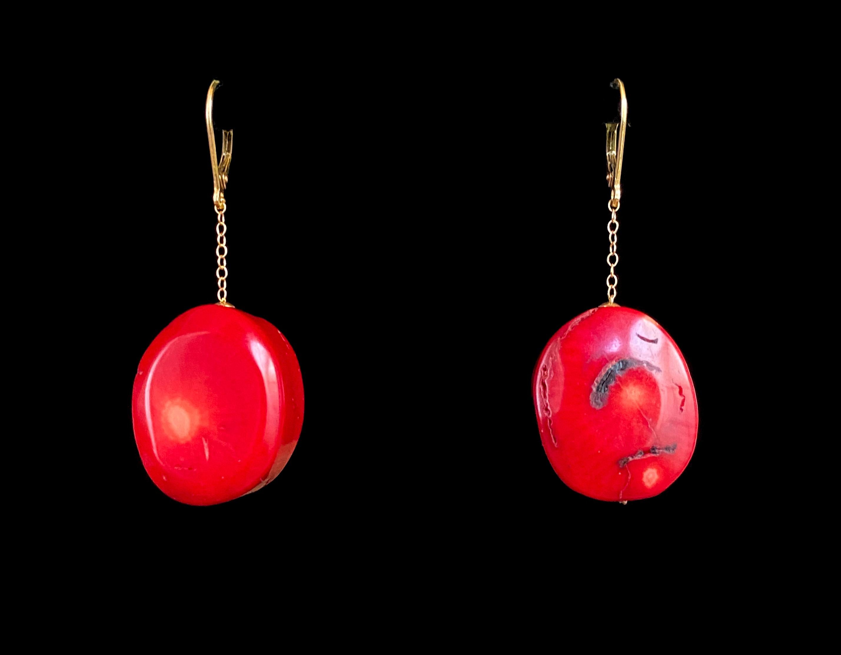 Marina J. presents these stunning Coral Earrings. This pair is made with two vibrant red Corals displaying organic inclusions and patterns. The Coral stones are 23 mm long, and perfectly complimented by the solid 14k Yellow Gold chain and hooks.