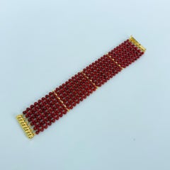 Bracciale intrecciato Marina J. con corallo e pietre sfaccettate, placcato in oro 18k