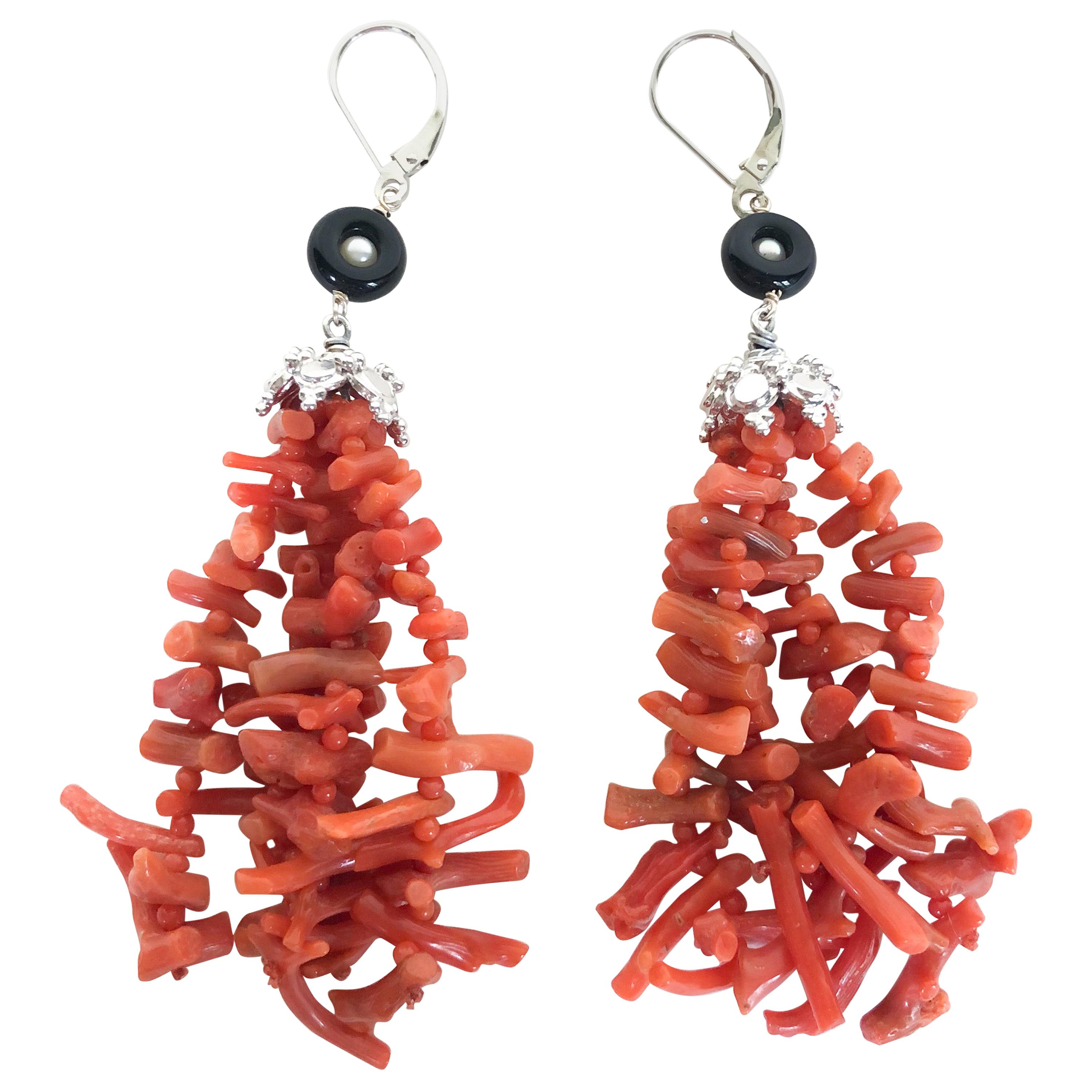 These gorgeous coral tassel earrings are vibrant and unique, which will be sure to make a statement with any look. The tassels are made of graduated coral sticks up to 2.5cm wide and 1mm coral beads. This pair features rhodium plated silver cup and