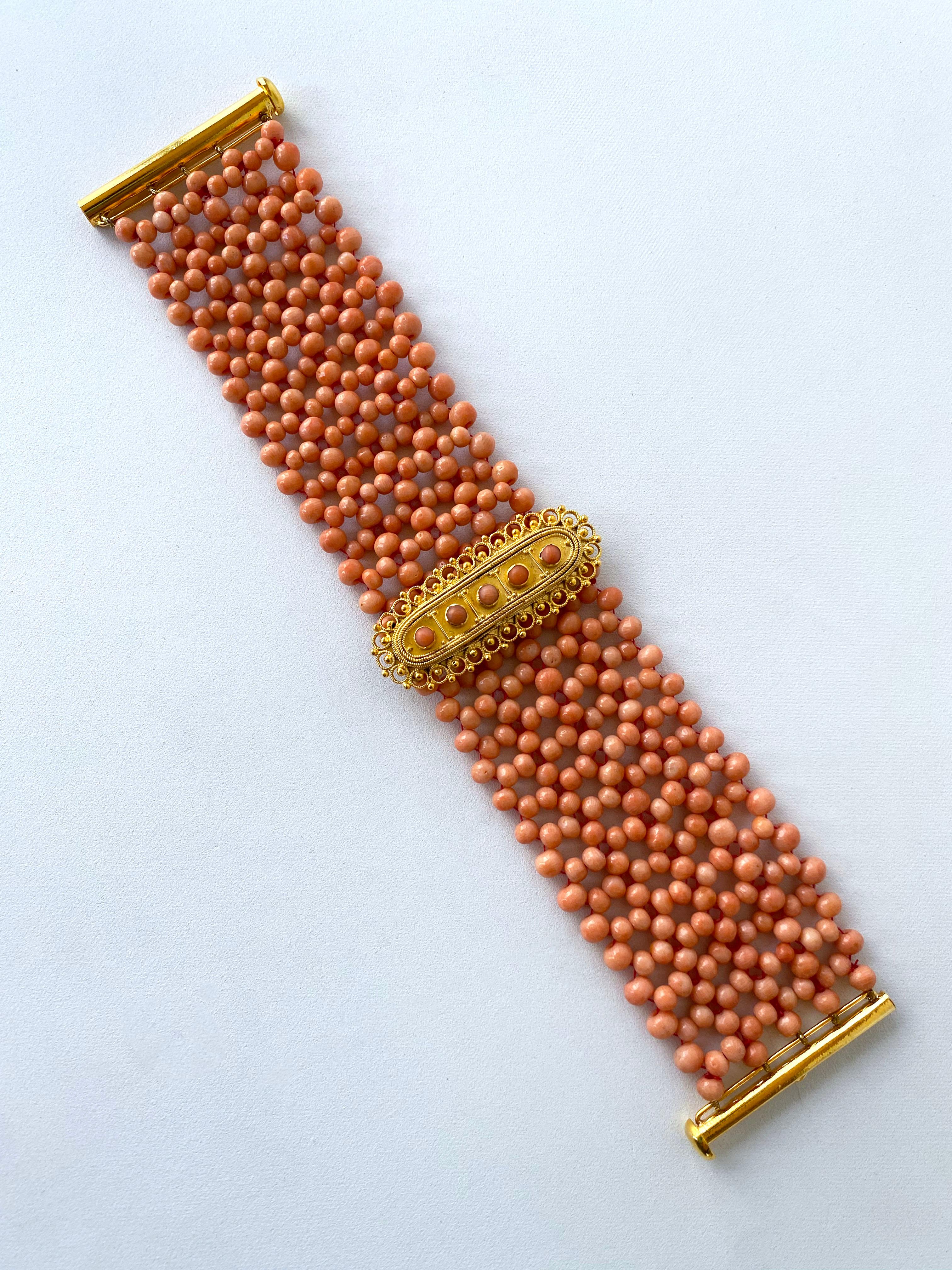 Gorgeous piece by Marina J. This bracelet is made using all natural Corals woven together into a laced like design. The Corals display a beautiful Sand Orange color and are perfectly complimented by the high shine 18k Yellow Gold Plated Centerpiece