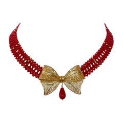 Marina J Coral Woven Necklace with 18k Plated Bowtie Centerpiece & Detailings